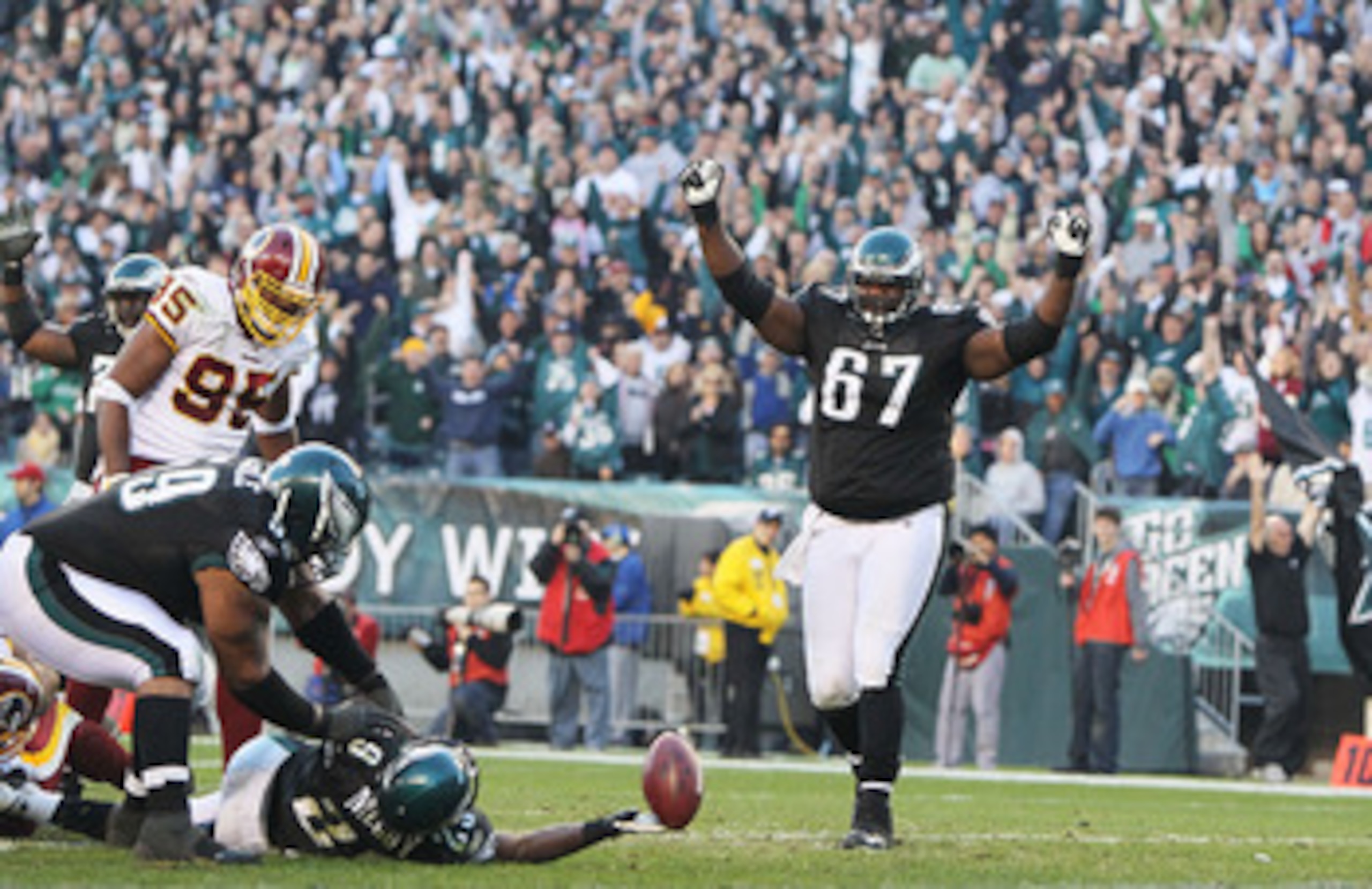 PHILADELPHIA - NOVEMBER 29:  LeSean McCoy #29 of the Philadelphia Eagles ties the game with a two-point conversion against  the Washington Redskins as teammates Jamaal Jackson #67 and Nick Cole #59 celebrate during their game at Lincoln Financial Field on