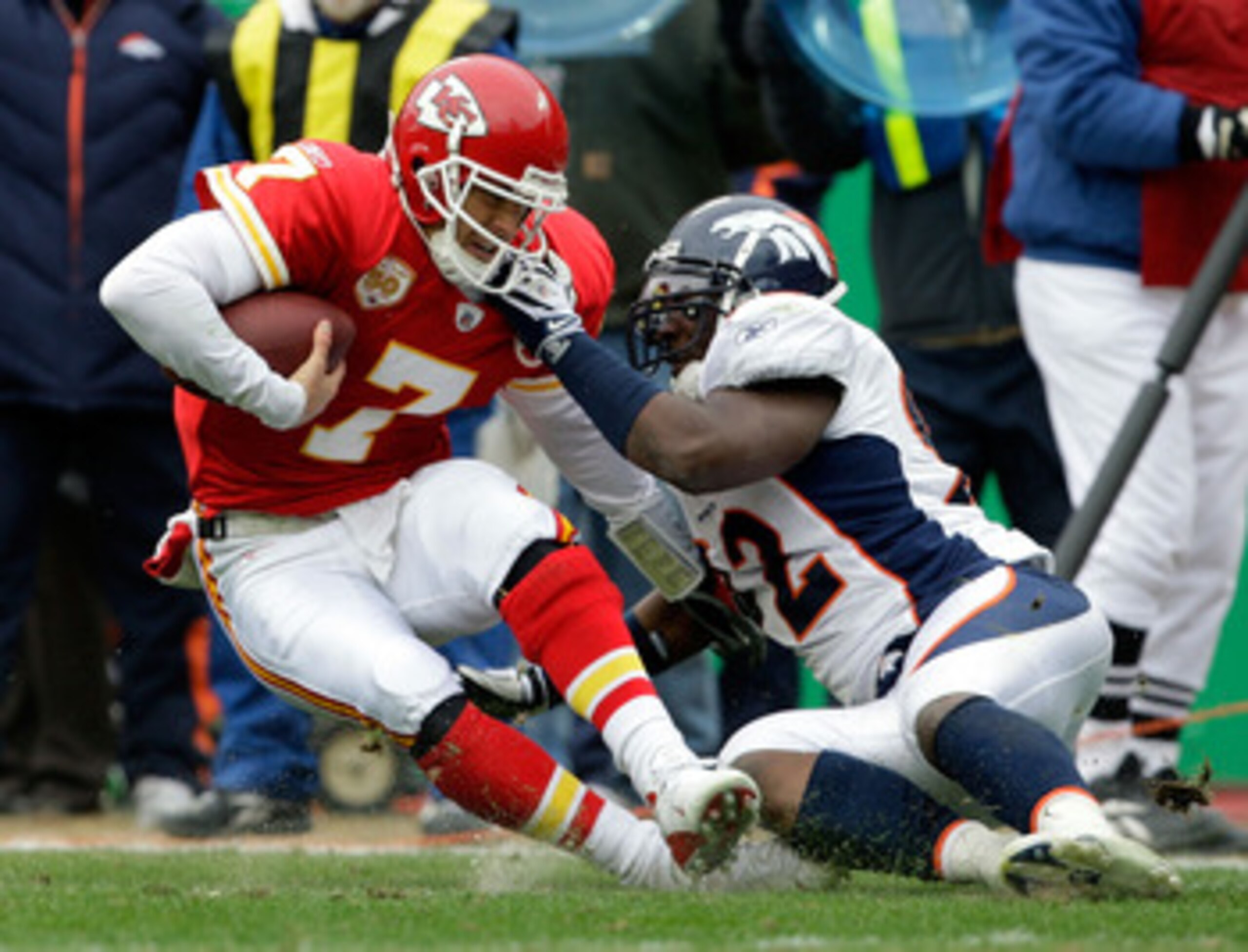 KANSAS CITY, MO - DECEMBER 06:  Quarterback Matt Cassel #7 of the Kansas City Chiefs is sacked by Elvis Dumervil #92 of the Denver Broncos during the game on December 6, 2009 at Arrowhead Stadium in Kansas City, Missouri.  (Photo by Jamie Squire/Getty Ima