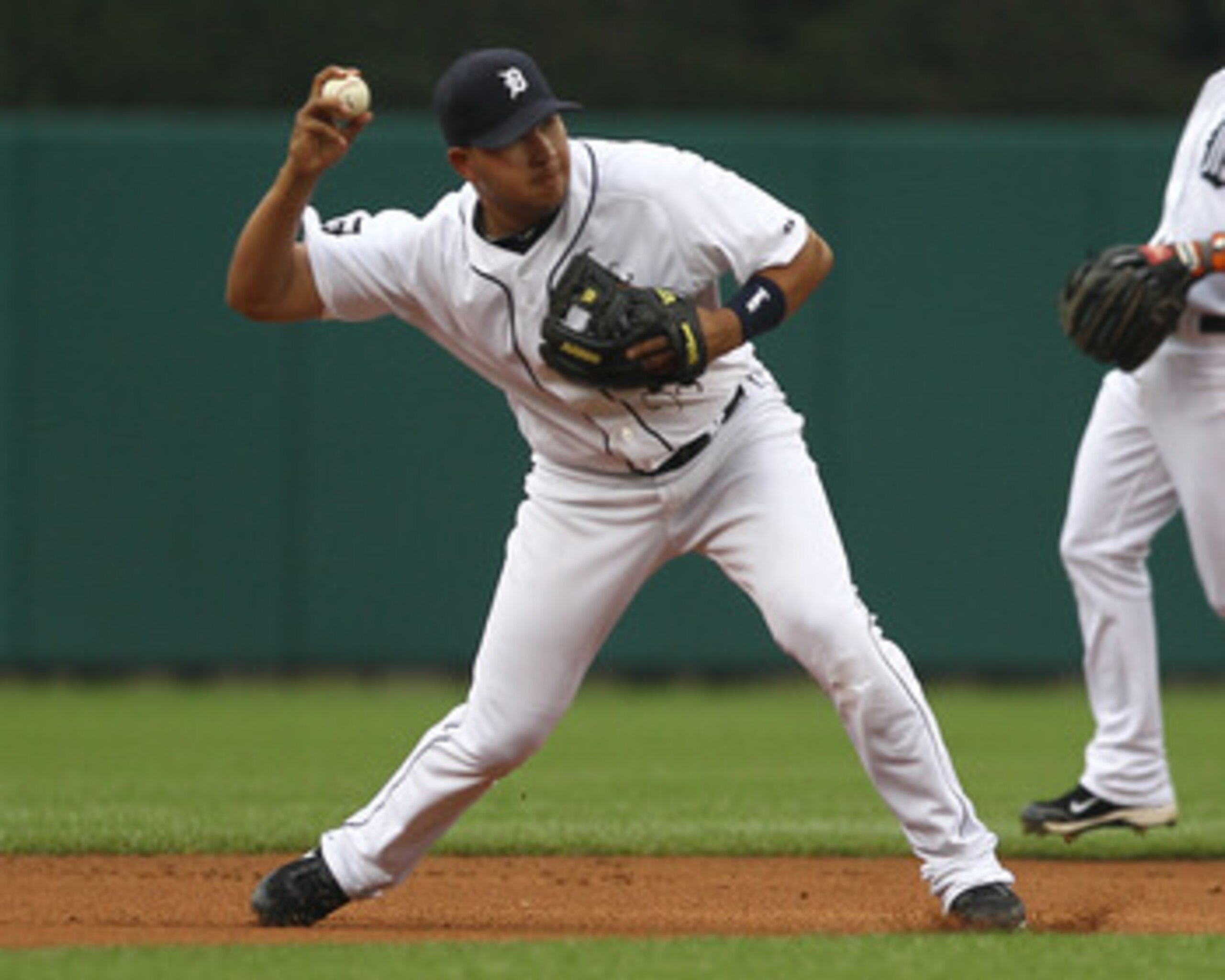 DETROIT, MI - JUNE 10:  Short Stop Jhonny Peralta #27 of the Detroit Tigers gets set to throw the ball to first base during a MLB game against the Seattle Mariners at Comerica Park on June 10, 2011 in Detroit, Michigan.  Seattle defeated Detroit 3-2.  (Ph