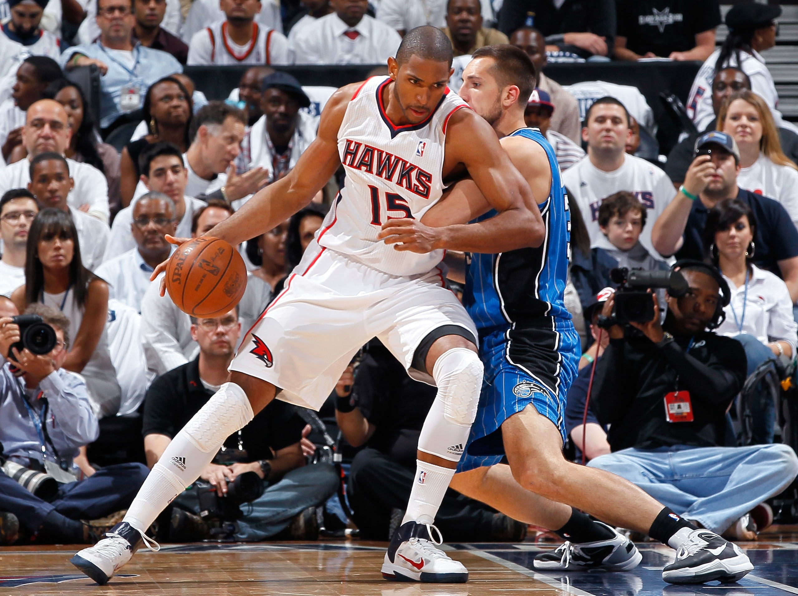 ATLANTA, GA - APRIL 22:  Al Horford #15 of the Atlanta Hawks against Ryan Anderson #33 of the Orlando Magic during Game Three of the Eastern Conference Quarterfinals in the 2011 NBA Playoffs at Philips Arena on April 22, 2011 in Atlanta, Georgia.  NOTE TO