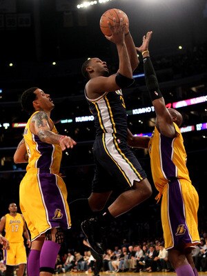 LOS ANGELES, CA - APRIL 05:  C.J. Miles #34 of the Utah Jazz shoots over Kobe Bryant #24 and Matt Barnes #9 of the Los Angeles Lakers at Staples Center on April 5, 2011 in Los Angeles, California. The Jazz won 86-85.  NOTE TO USER: User expressly acknowle