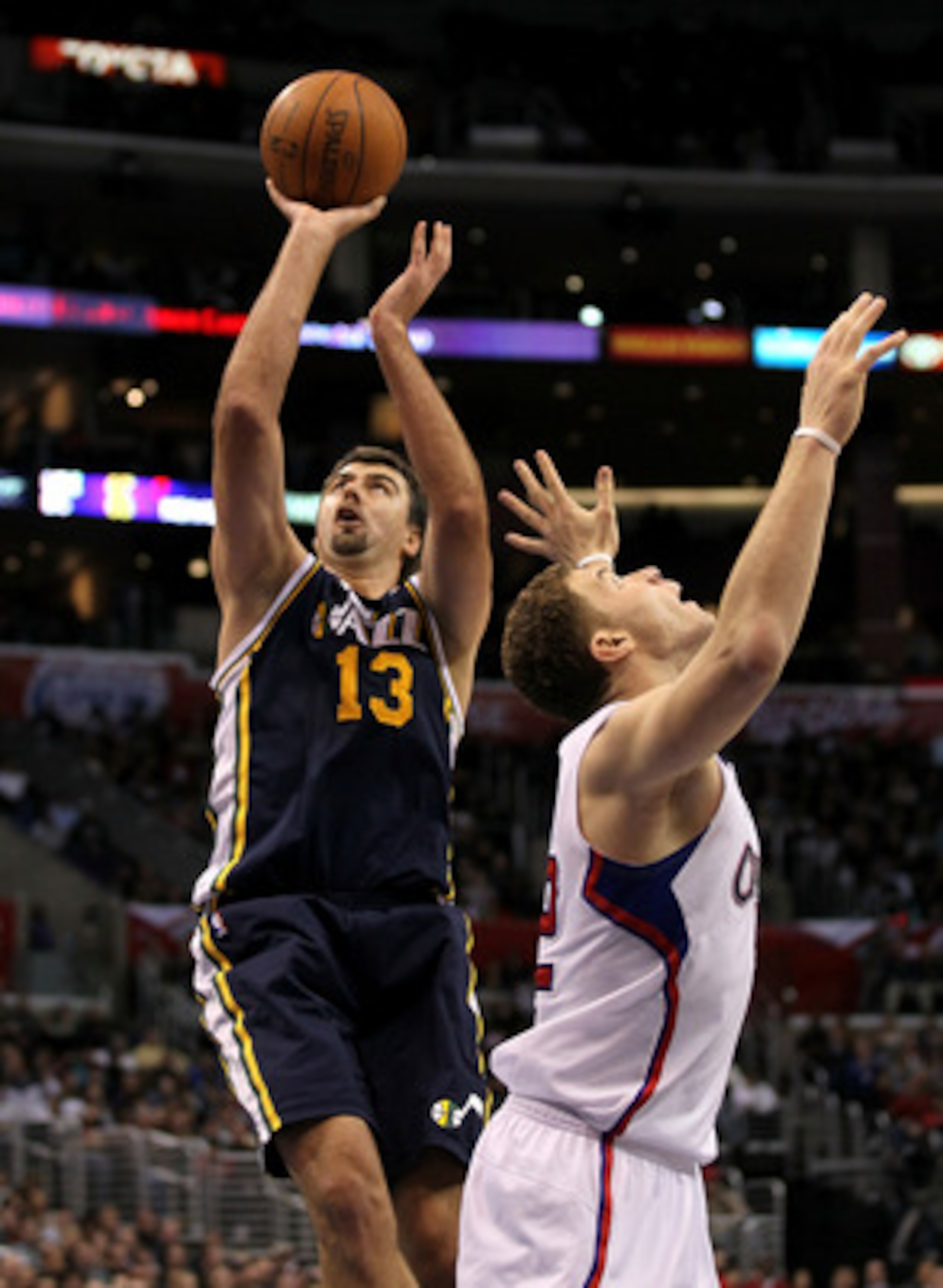 LOS ANGELES, CA - DECEMBER 29:  Mehmet Okur #13 of the Utah Jazz shoots over Blake Griffin #32 of the Los Angeles Clippers at Staples Center on December 29, 2010 in Los Angeles, California.   The Jazz won 103-85.  NOTE TO USER: User expressly acknowledges