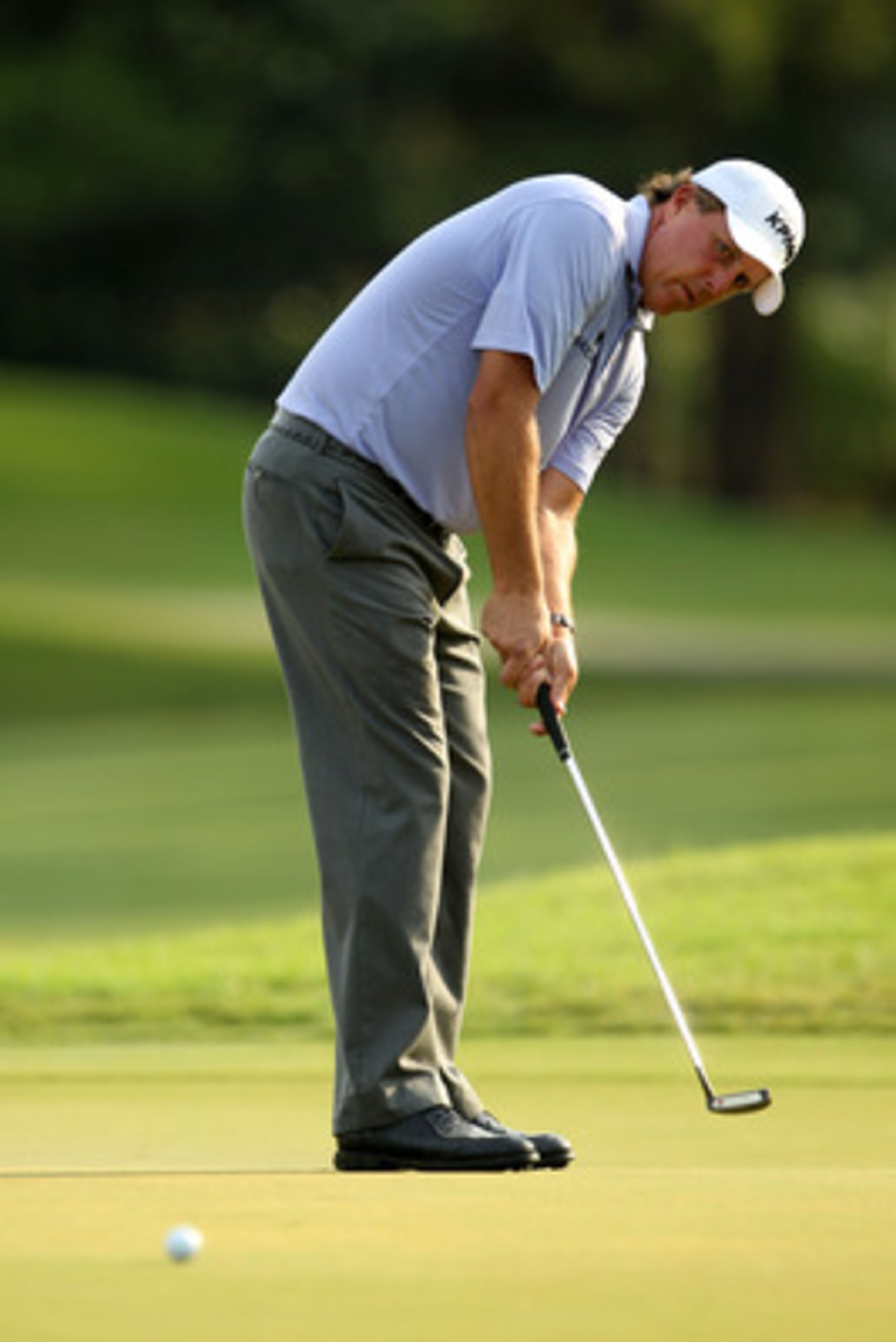 PONTE VEDRA BEACH, FL - MAY 13:  Phil Mickelson putts on the 11th green during the second round of THE PLAYERS Championship held at THE PLAYERS Stadium course at TPC Sawgrass on May 13, 2011 in Ponte Vedra Beach, Florida.  (Photo by Mike Ehrmann/Getty Ima