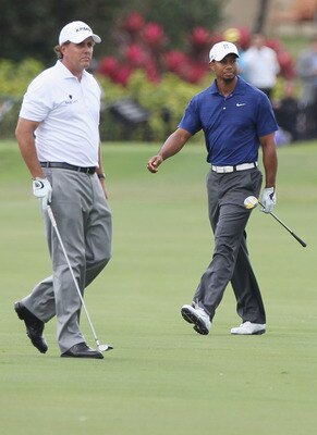 DORAL, FL - MARCH 10:  Tiger Woods (R) and Phil Mickelson watch a shot on the tenth hole during the first round of the 2011 WGC- Cadillac Championship at the TPC Blue Monster at the Doral Golf Resort and Spa on March 10, 2011 in Doral, Florida.  (Photo by