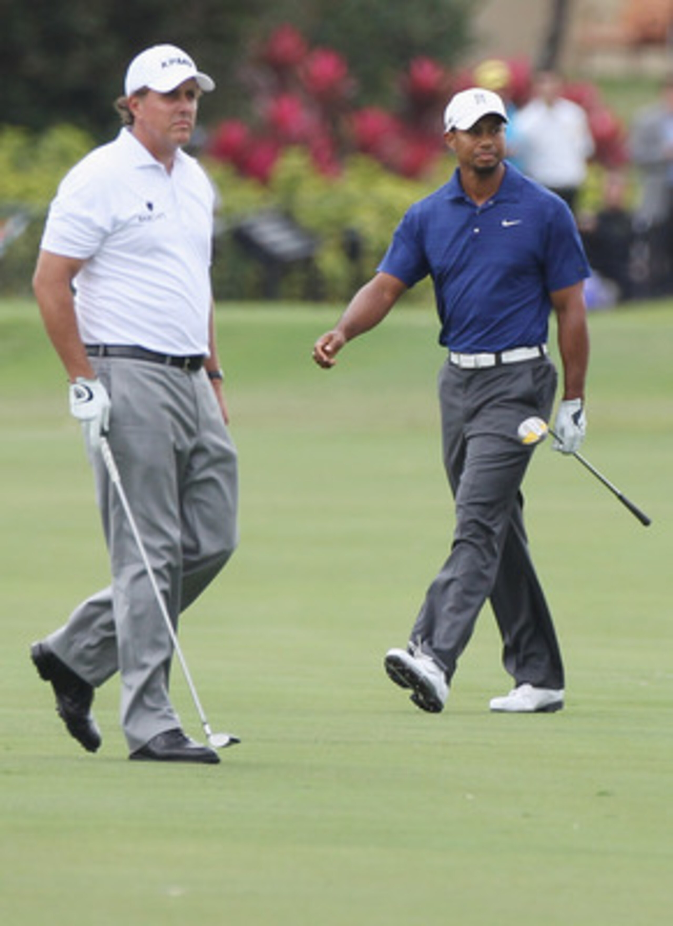 DORAL, FL - MARCH 10:  Tiger Woods (R) and Phil Mickelson watch a shot on the tenth hole during the first round of the 2011 WGC- Cadillac Championship at the TPC Blue Monster at the Doral Golf Resort and Spa on March 10, 2011 in Doral, Florida.  (Photo by