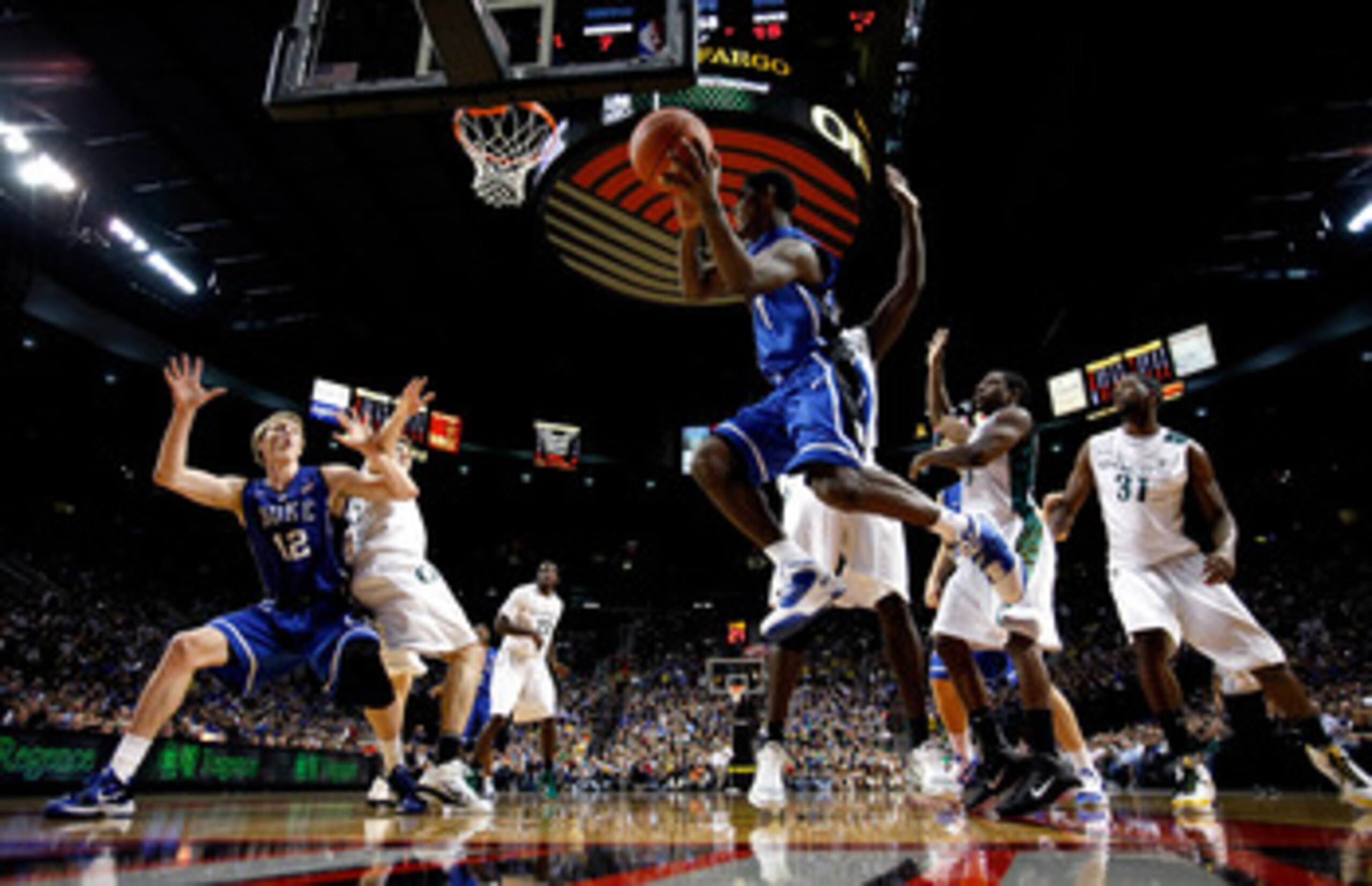 PORTLAND, OR - NOVEMBER 27:  Kyrie Irving #1 of the Duke Blue Devils looks to pass the ball to teammate Kyle Singler #12 against the Oregon Ducks on November 27, 2010 at the Rose Garden in Portland, Oregon.  (Photo by Jonathan Ferrey/Getty Images)
