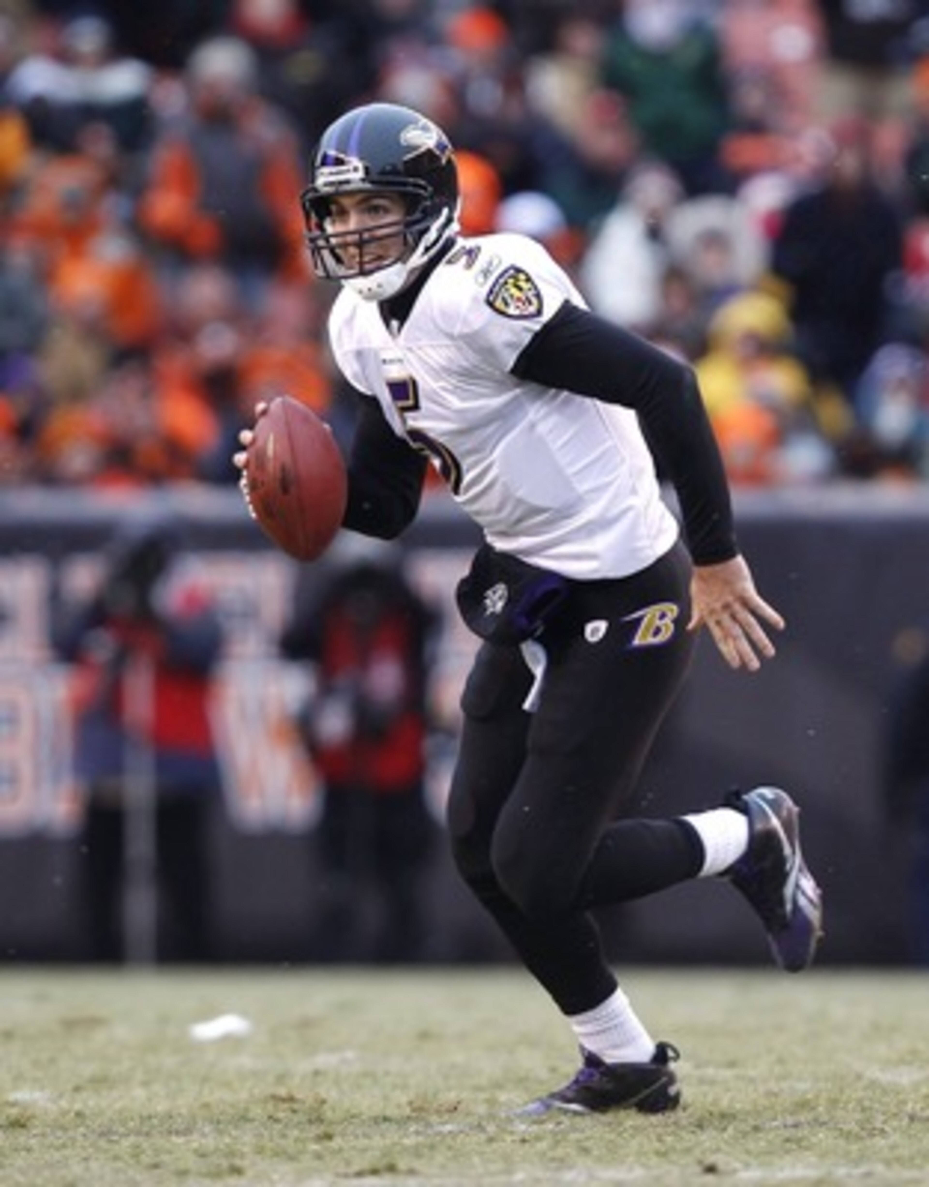 CLEVELAND - DECEMBER 26:  Quarterback Joe Flacco #5 of the Baltimore Ravens runs against the Cleveland Browns at Cleveland Browns Stadium on December 26, 2010 in Cleveland, Ohio.  (Photo by Matt Sullivan/Getty Images)