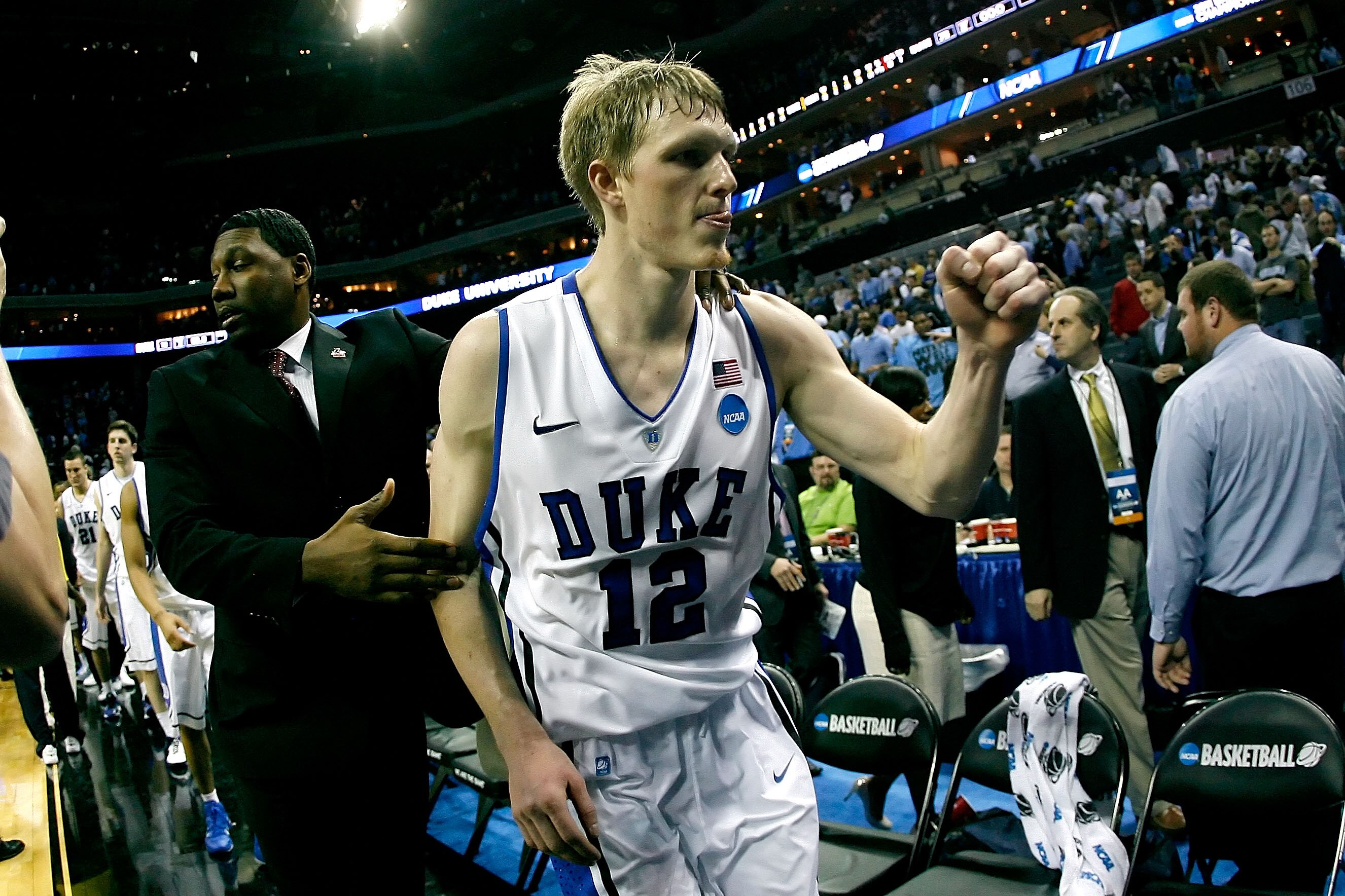 CHARLOTTE, NC - MARCH 20:  Kyle Singler #12 of the Duke Blue Devils reacts after the Blue Devils defeated the Michigan Wolverines 73-71 during the third round of the 2011 NCAA men's basketball tournament at Time Warner Cable Arena on March 20, 2011 in Cha