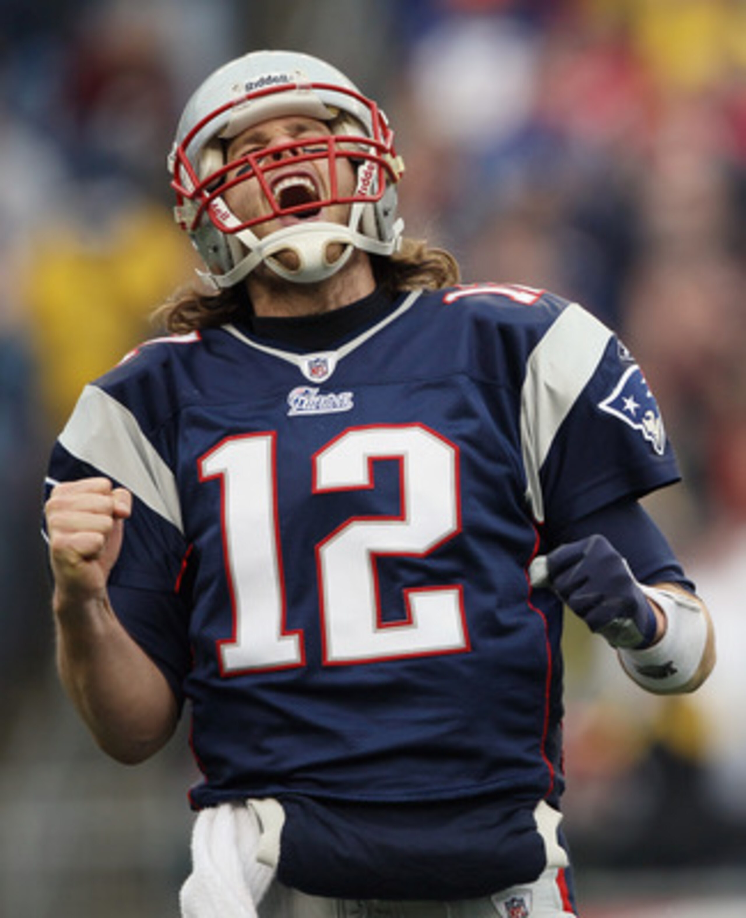 FOXBORO, MA - JANUARY 02:  Tom Brady #12 of the New England Patriots celebrates the touchdown by teammate BenJarvis Green-Ellis in the first quarter against the Miami Dolphins on January 2, 2011 at Gillette Stadium in Foxboro, Massachusetts.  (Photo by El