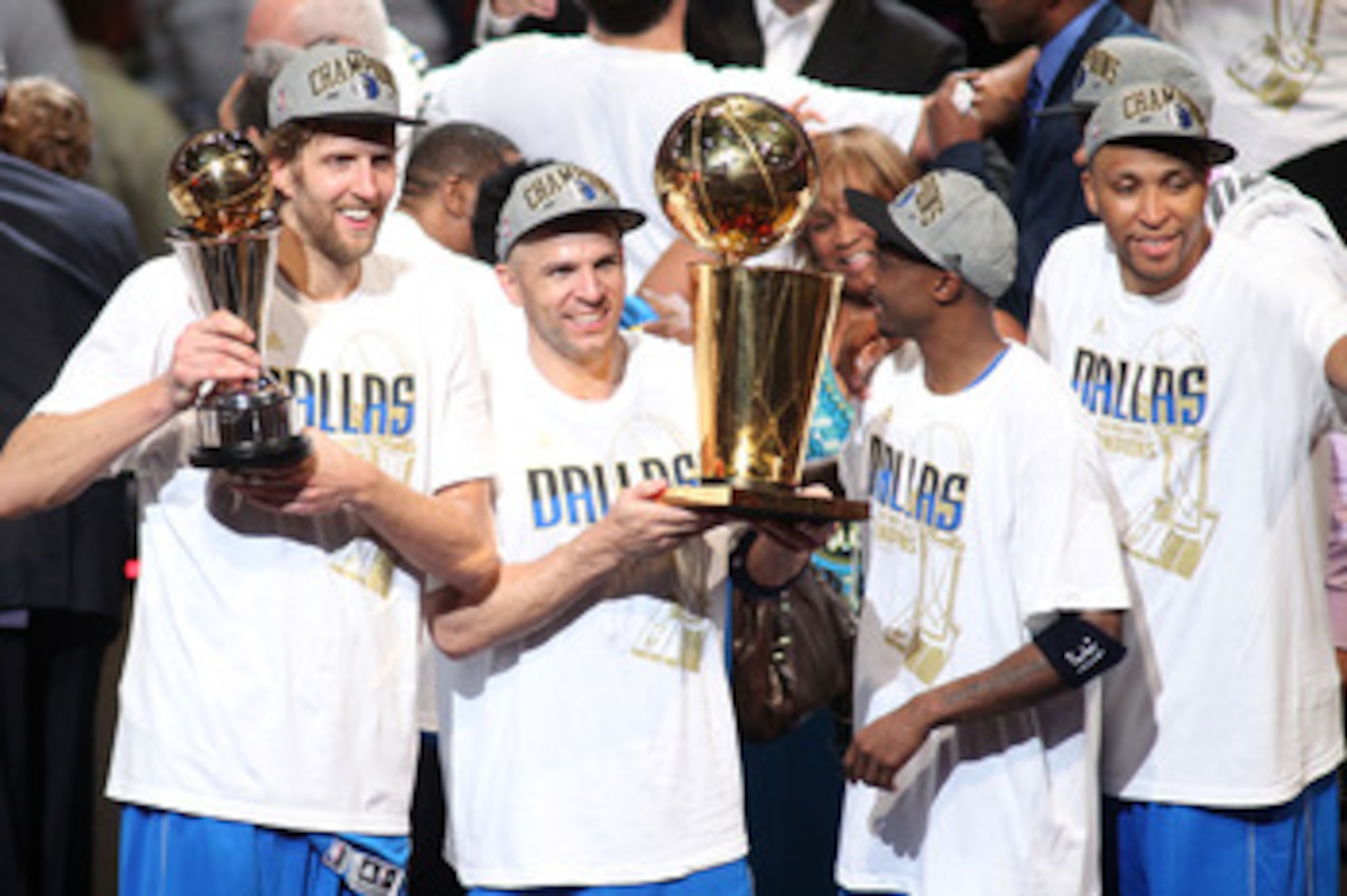 MIAMI, FL - JUNE 12:  (L-R) Finals MVP Dirk Nowitzki #41, Jason Kidd #2, Jason Terry #31 and Shawn Marion #0 of the Dallas Mavericks celebrate with the Larry O'Brien trophy after they won 105-95 against the Miami Heat in Game Six of the 2011 NBA Finals at