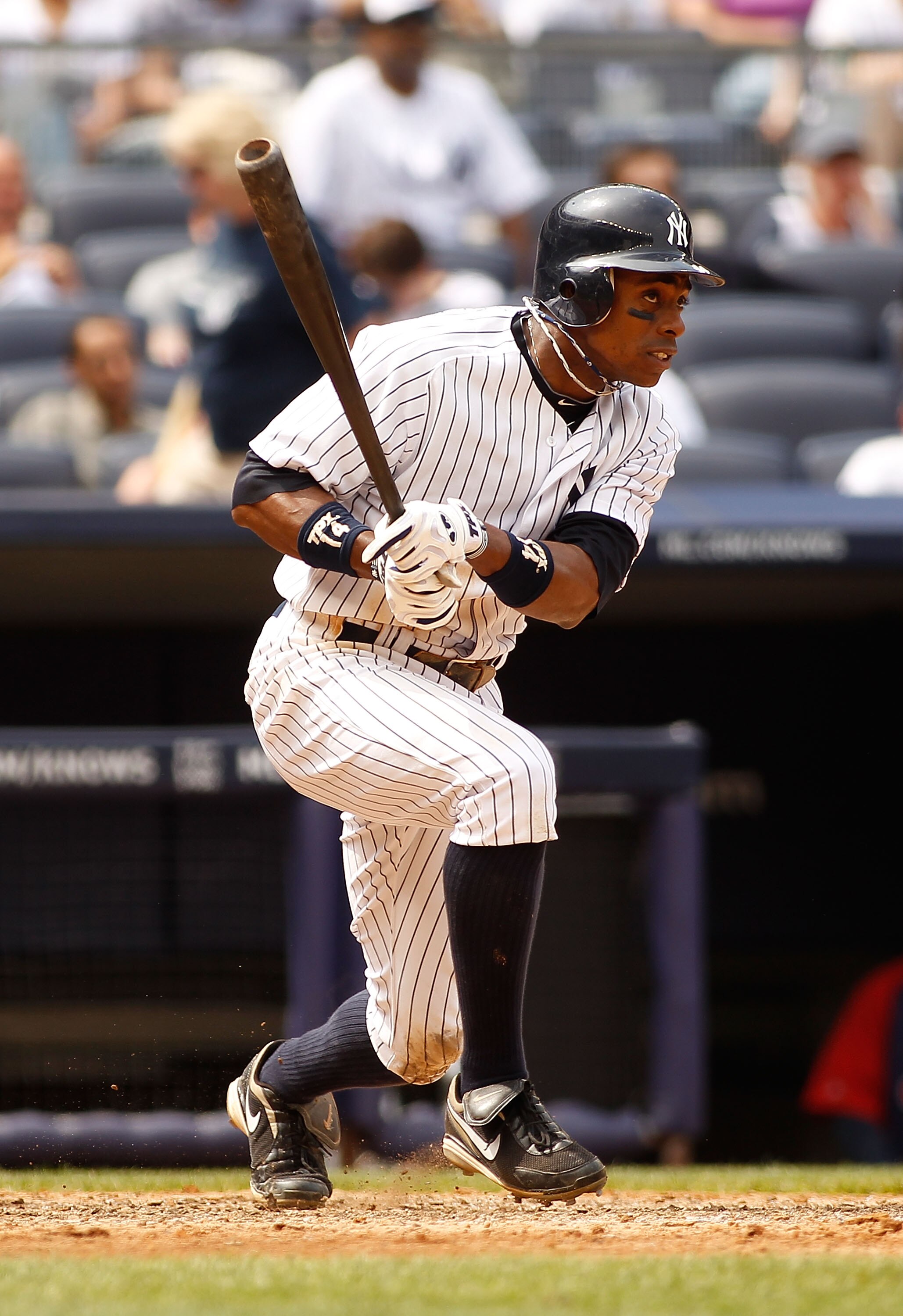 NEW YORK - JUNE 12:  Curtis Granderson #14 of the New York Yankees hits a single against the Cleveland Indians on June 12, 2011 at Yankee Stadium in the Bronx borough of New York City. The Yankees defeated the Indians 9-1. (Photo by Mike Stobe/Getty Image