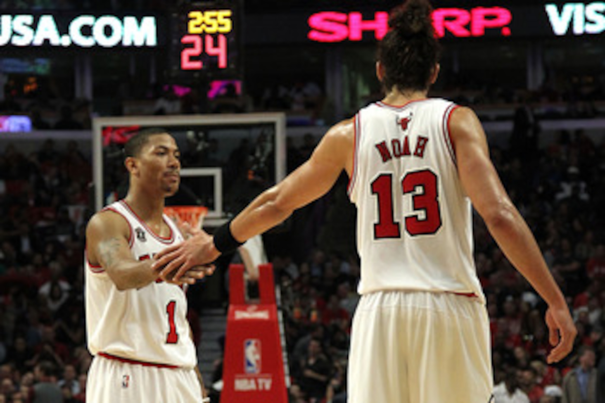 CHICAGO, IL - MAY 26: Derrick Rose #1 and Joakim Noah #13 of the Chicago Bulls celebrate a play against the Miami Heat in Game Five of the Eastern Conference Finals during the 2011 NBA Playoffs on May 26, 2011 at the United Center in Chicago, Illinois. NO