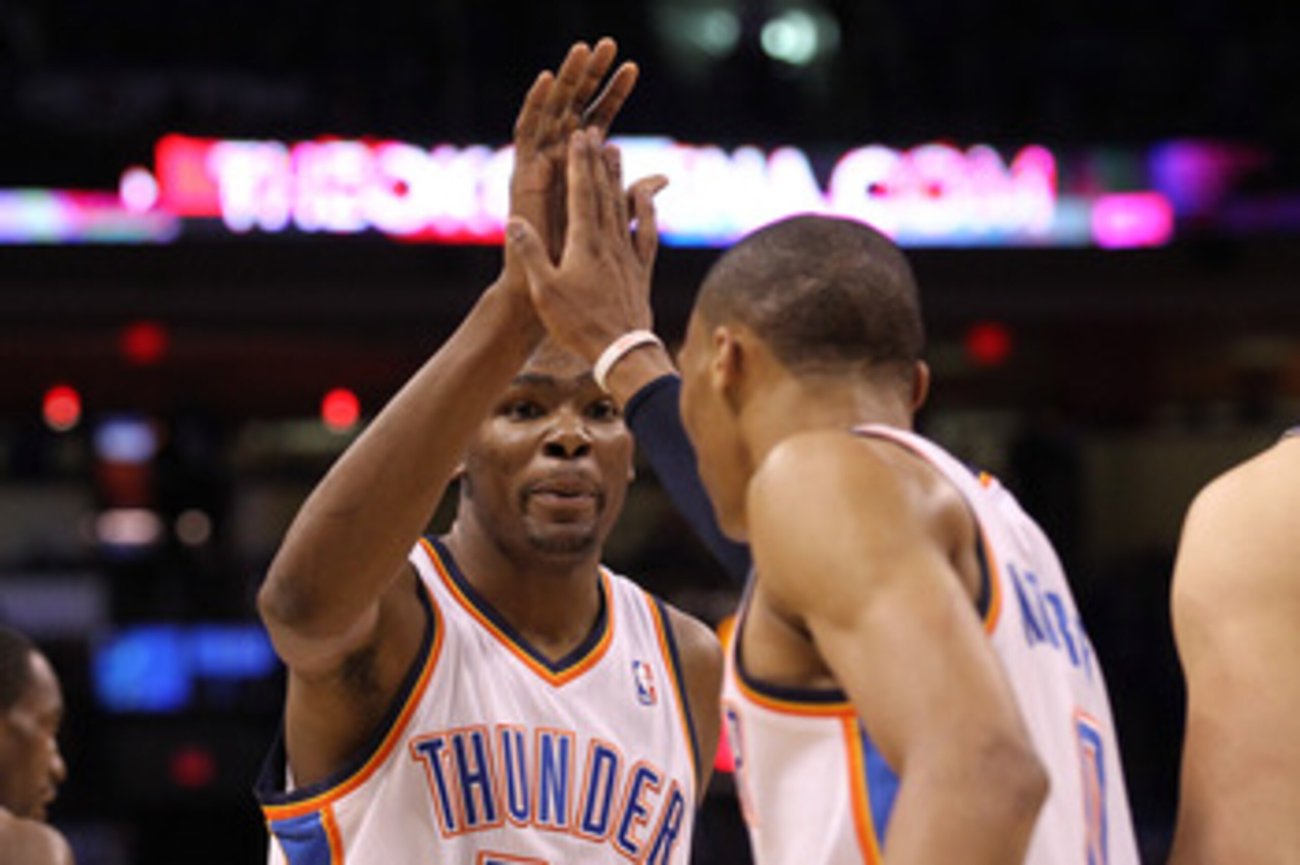OKLAHOMA CITY, OK - MAY 23:  Kevin Durant #35 of the Oklahoma City Thunder reacts with teammate Russell Westbrook #0 in the first quarter against the Dallas Mavericks in Game Four of the Western Conference Finals during the 2011 NBA Playoffs at Oklahoma C