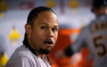 OAKLAND, CA - MAY 02:  Coco Crisp #4 of the Oakland Athletics stands in the dugout before their game against the Texas Rangers at Oakland-Alameda County Coliseum on May 2, 2011 in Oakland, California.  (Photo by Ezra Shaw/Getty Images)