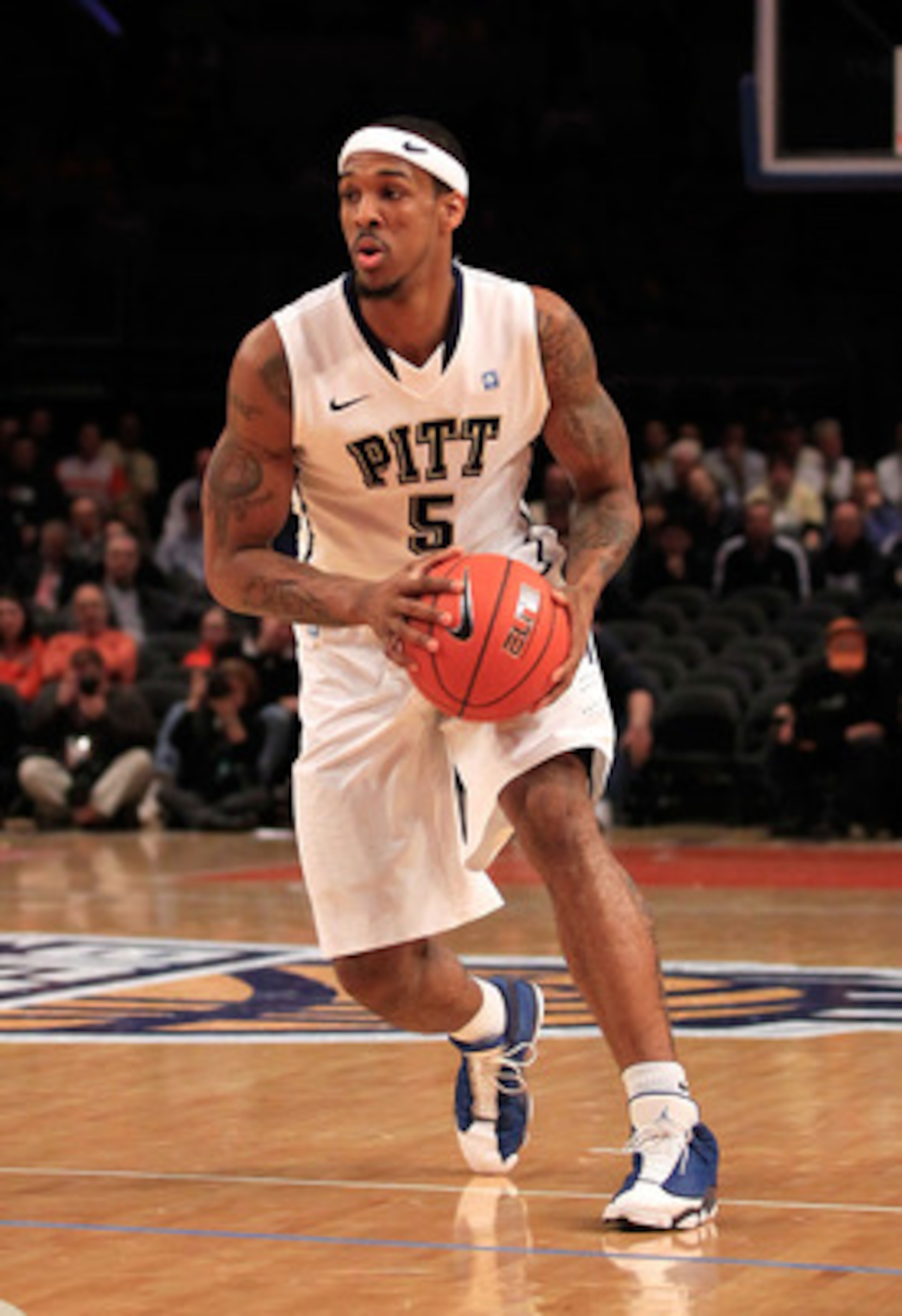 NEW YORK, NY - MARCH 10: Gilbert Brown #5 of the Pittsburgh Panthers brings the ball up court against the Connecticut Huskies during the quarterfinals of the 2011 Big East Men's Basketball Tournament presented by American Eagle Outfitters  at Madison Squa