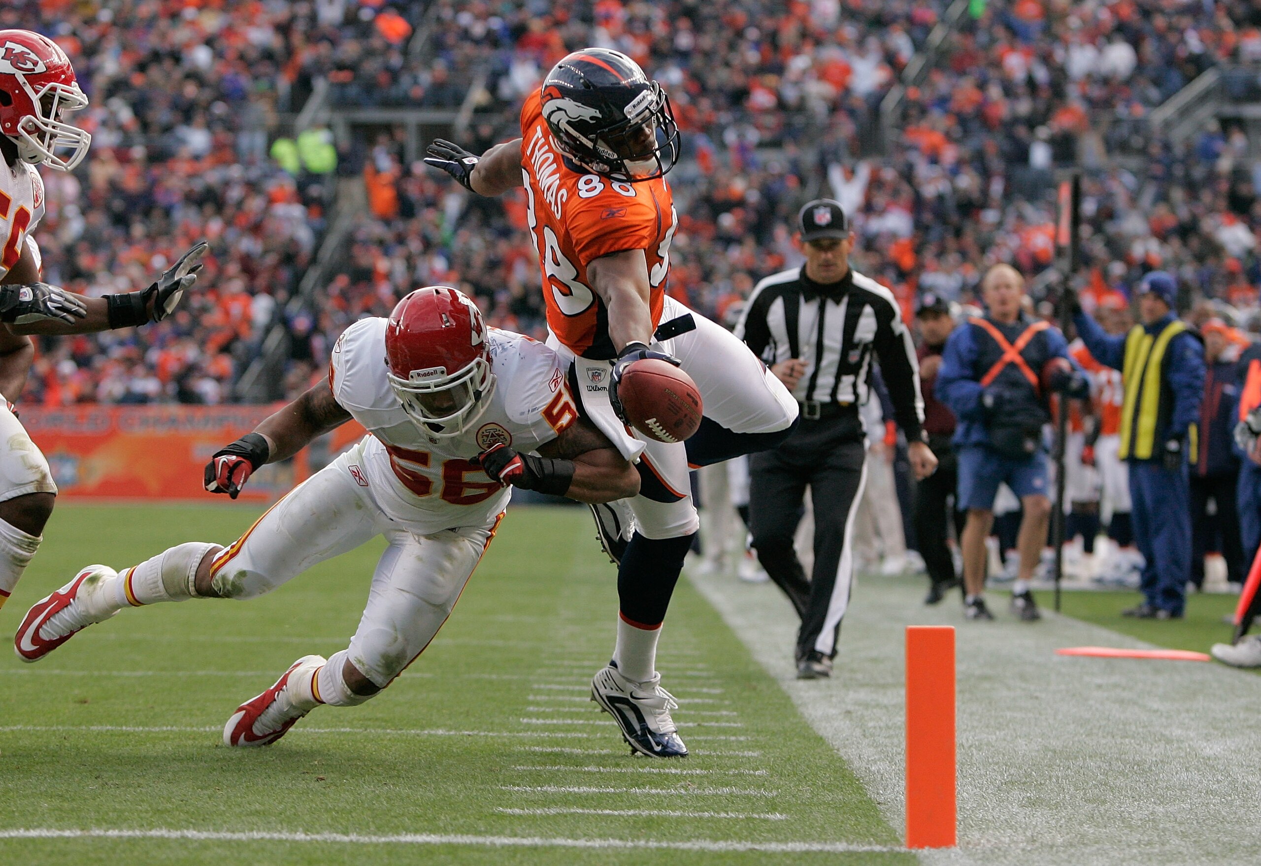 DENVER - NOVEMBER 14:  Wide receiver Demaryius Thomas #88 of the Denver Broncos stretches the ball towards the goal line but is knocked out of bounds by linebacker Derrick Johnson #56 of the Kansas City Chiefs at the 1-yard-line during the second quarter 