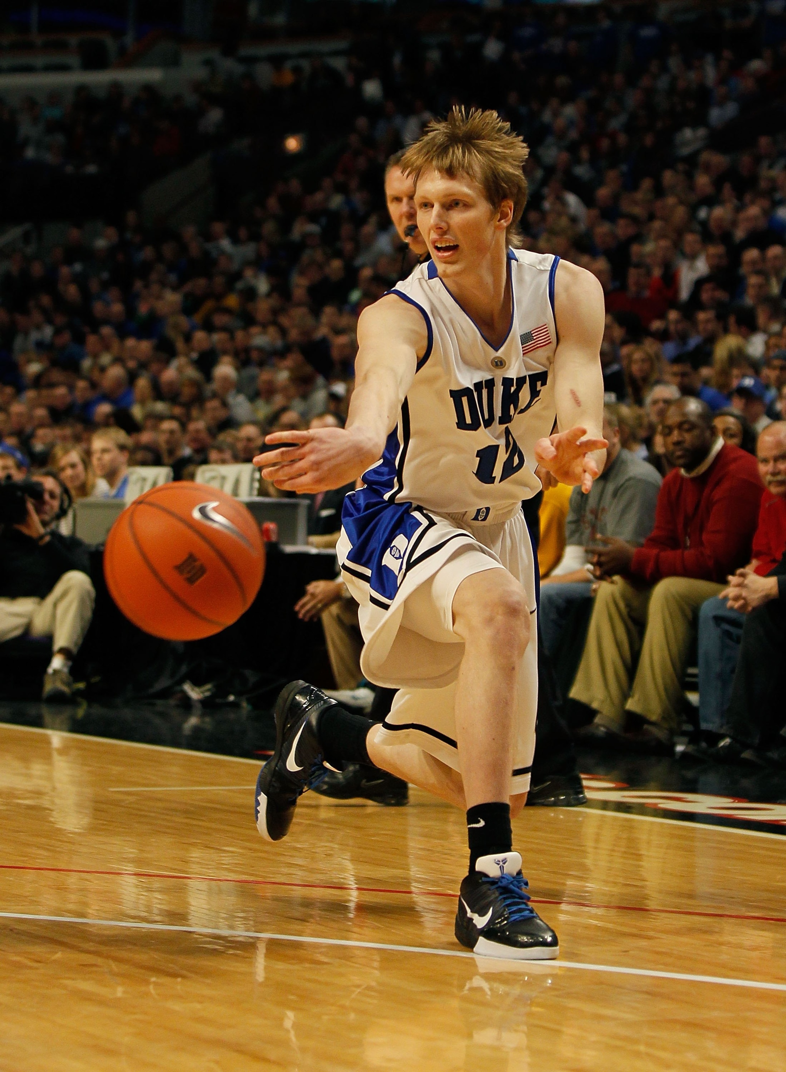 CHICAGO - JANUARY 06: Kyle Singler #12 of the Duke Blue Devils passes the ball against the Iowa State Cyclones at the United Center on January 6, 2010 in Chicago, Illinois. Duke defeated Iowa State 86-65.  (Photo by Jonathan Daniel/Getty Images)