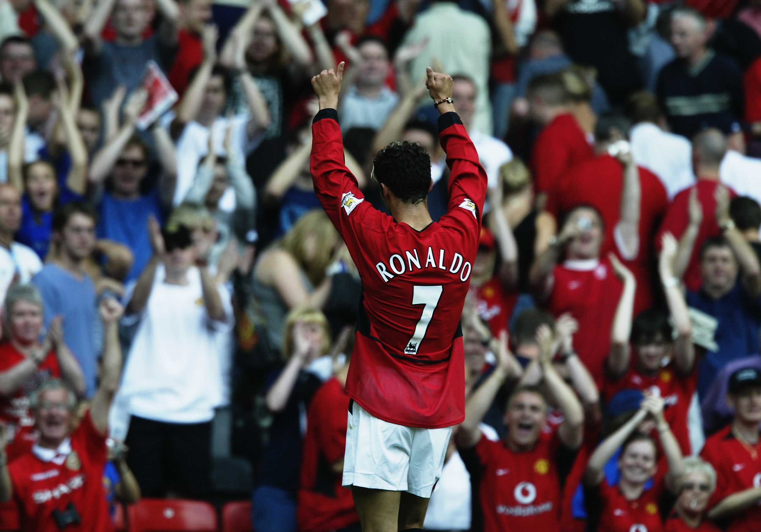 MANCHESTER - AUGUST 16:  Cristiano Ronaldo of Manchester United salutes the fans during the FA Barclaycard Premiership match between Manchester United and Bolton Wanderers held on August 16, 2003 at Old Trafford, in Manchester, England. Manchester United