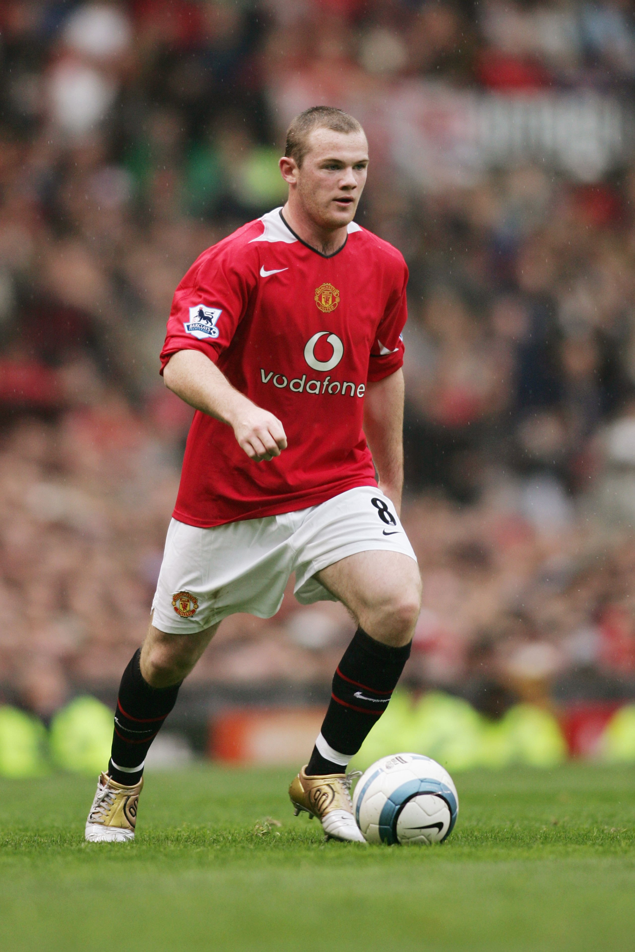 MANCHESTER, ENGLAND - OCTOBER 3:  Wayne Rooney of Manchester United runs with the ball during the FA Barclaycard Premiership match between Manchester United and Middlesbrough at Old Trafford on October 3, 2004 in Manchester, England.  (Photo by Michael St