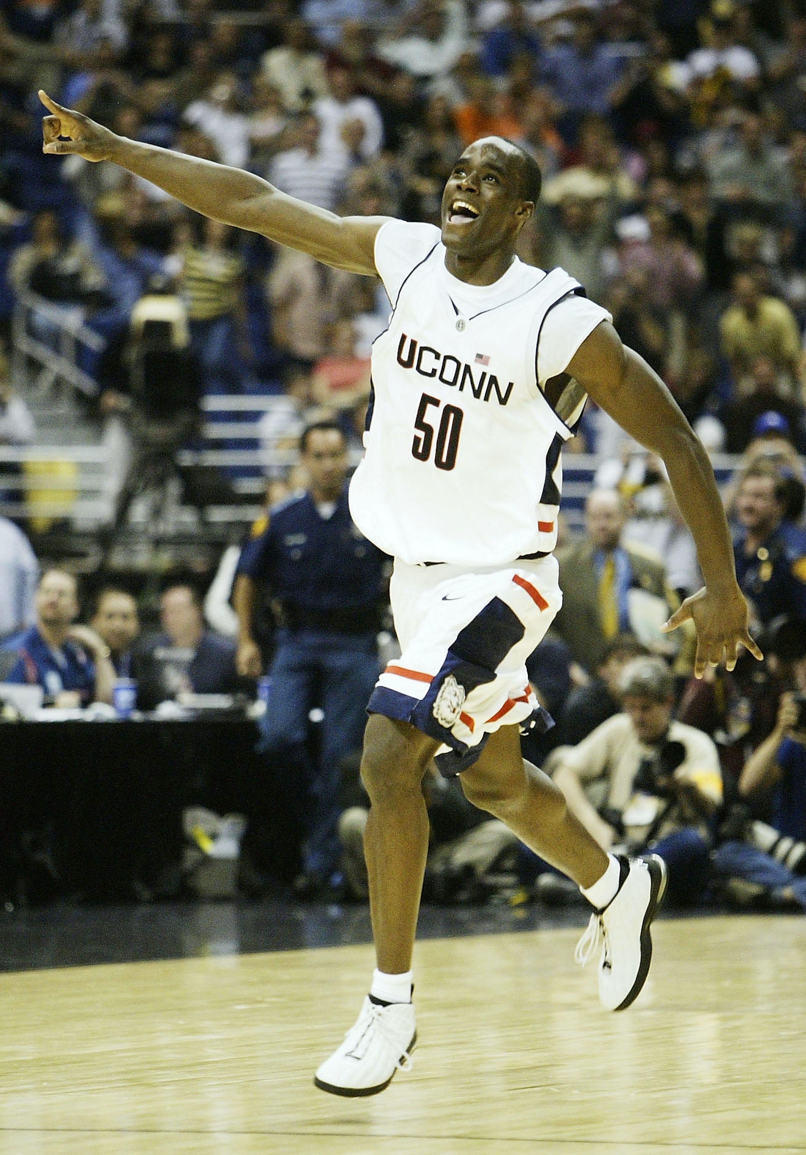 SAN ANTONIO - APRIL 5:  Emeka Okafor #50 of the UConn Huskies celebrates after defeating the Georgia Tech Yellow Jackets 82-73 during the National Championship game of the NCAA Men's Final Four Tournament at the Alamodome on April 5, 2004 in San Antonio,