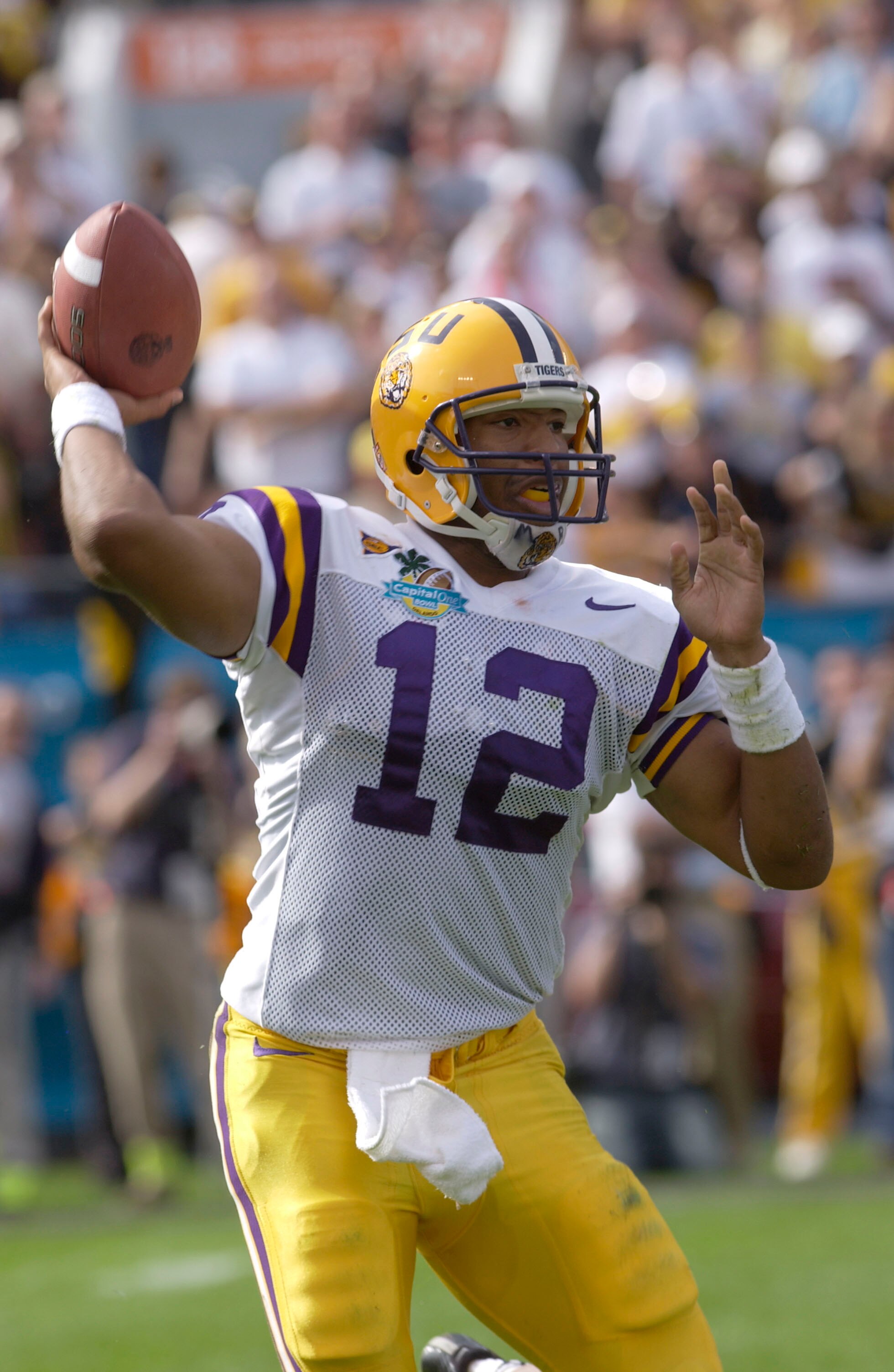 ORLANDO, FL - JANUARY 1:  Marcus Randall #12 of the LSU Tigers passes against the Iowa Hawkeyes during the Capital One Bowl at the Florida Citrus Bowl on January 1, 2005 in Orlando, Florida.  (Photo by Matt Stroshane/Getty Images)