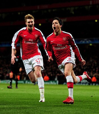 LONDON, ENGLAND - MARCH 09: Samir Nasri (R) of Arsenal celebrates with teammate Nicklas Bendtner after scoring his team's third goal during the UEFA Champions League round of 16 match between Arsenal and FC Porto at the Emirates Stadium on March 9, 2010 LONDON, ENGLAND - MARCH 09: Samir Nasri (R) of Arsenal celebrates with teammate Nicklas Bendtner after scoring his team's third goal during the UEFA Champions League round of 16 match between Arsenal and FC Porto at the Emirates Stadium on March 9, 2010