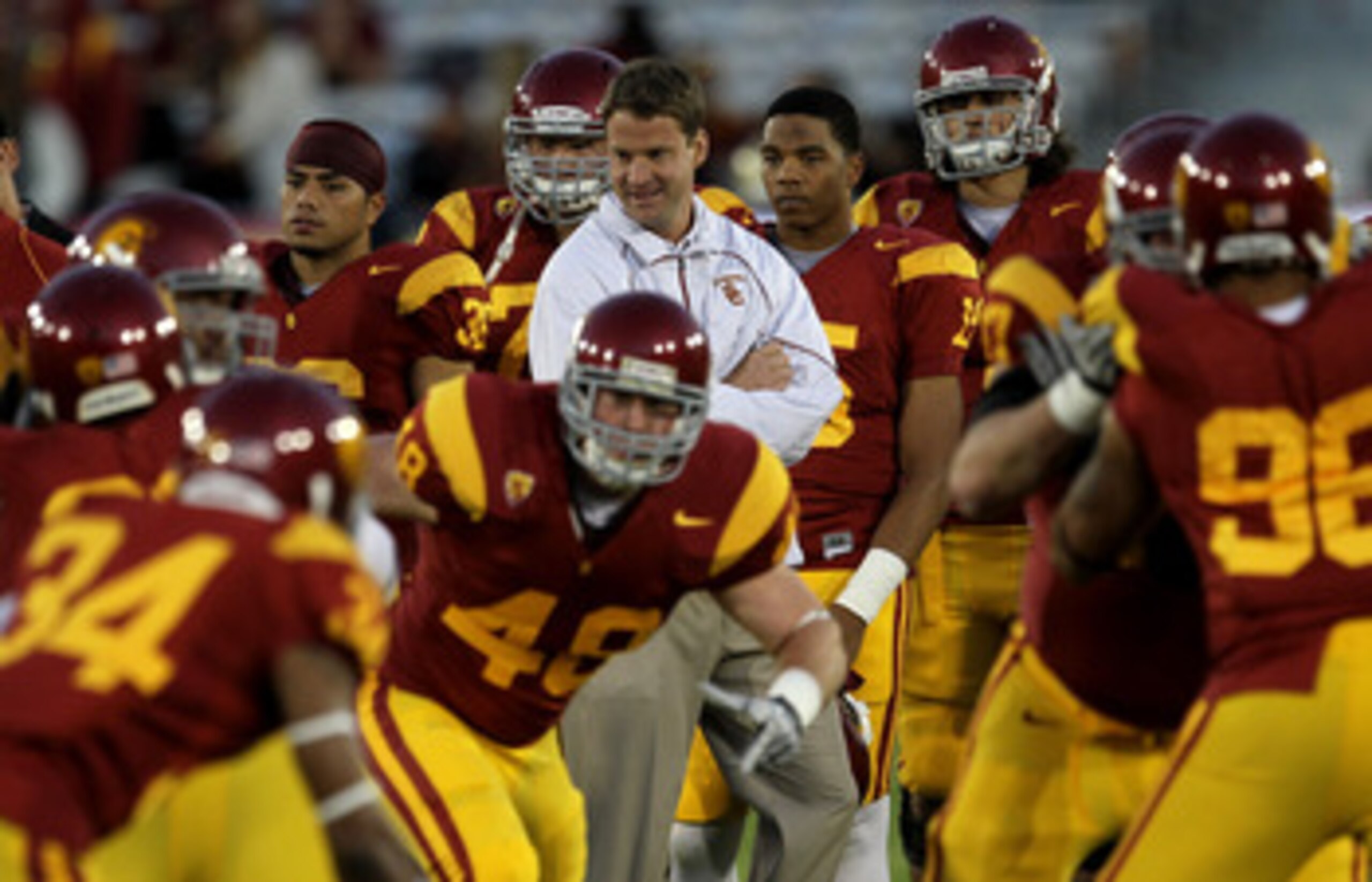 LOS ANGELES - NOVEMBER 27:  Head coach Lane Kiffin of the USC Trojans watches warmups for the game with the Notre Dame Fighting Irish at the Los Angeles Memorial Coliseum on November 27, 2010 in Los Angeles, California.   (Photo by Stephen Dunn/Getty Imag