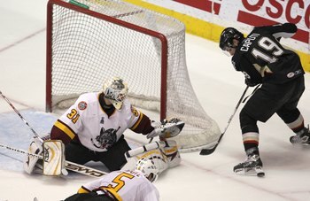 ROSEMONT, IL - JUNE 10: Ondrej Pavelec #19 of the Chicago Wolves guards the net against Luca Caputi #19 of the Wilkes-Barre/Scranton Penguins during the Calder Cup Finals on June 10, 2008 at the Allstate Arena in Rosemont, Illinois. The Wolves defeated th
