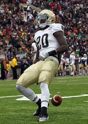 EL PASO, TX - DECEMBER 30:  Running back Cierre Wood #20 of the Notre Dame Fighting Irish celebrates a touchdown against the Miami Hurricanes during the Hyundai Sun Bowl at Sun Bowl on December 30, 2010 in El Paso, Texas.  (Photo by Ronald Martinez/Getty