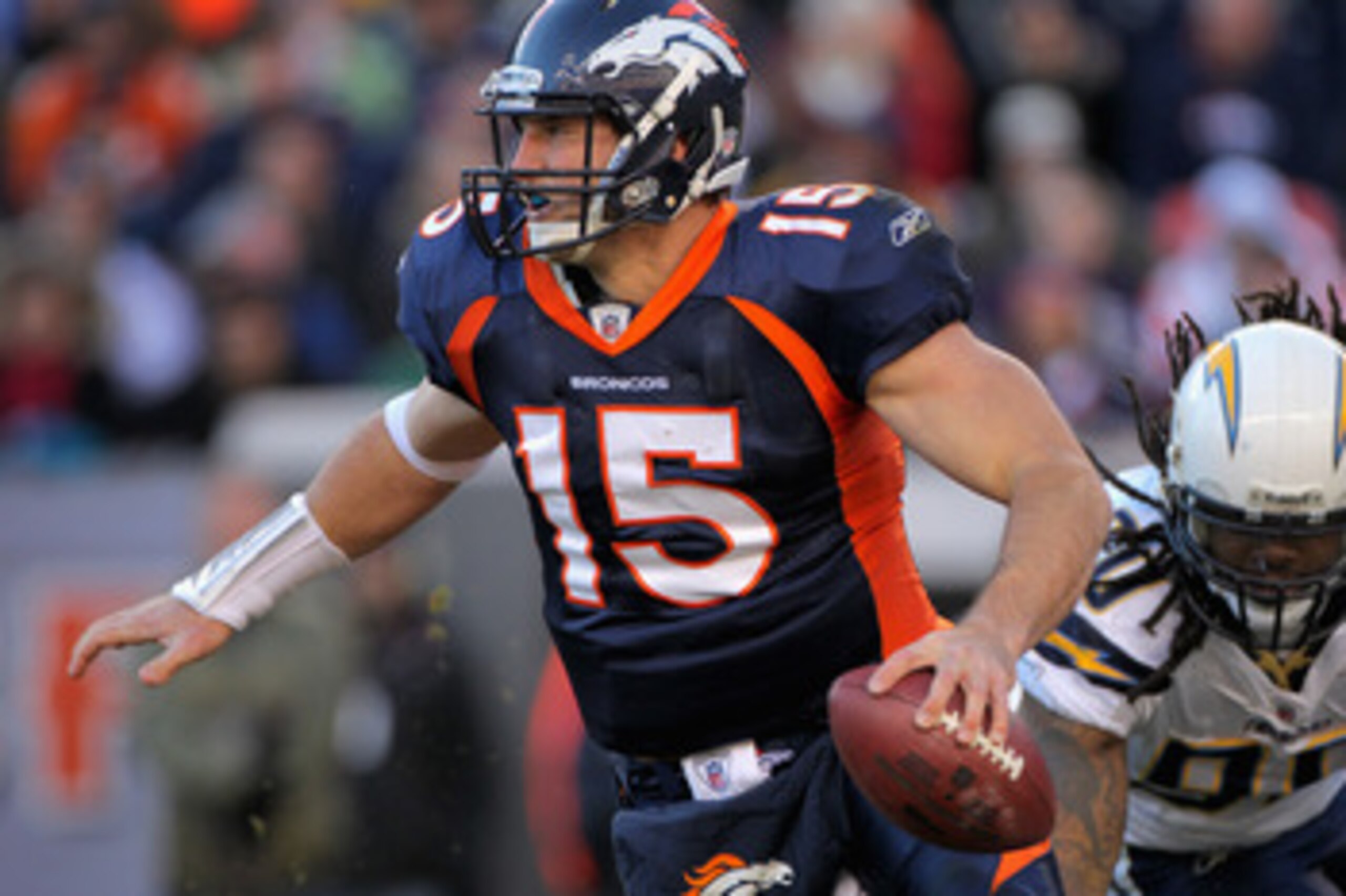 DENVER - JANUARY 02:  Quarterback Tim Tebow #15 of the Denver Broncos scrambles against the San Diego Chargers at INVESCO Field at Mile High on January 2, 2011 in Denver, Colorado.  (Photo by Doug Pensinger/Getty Images)