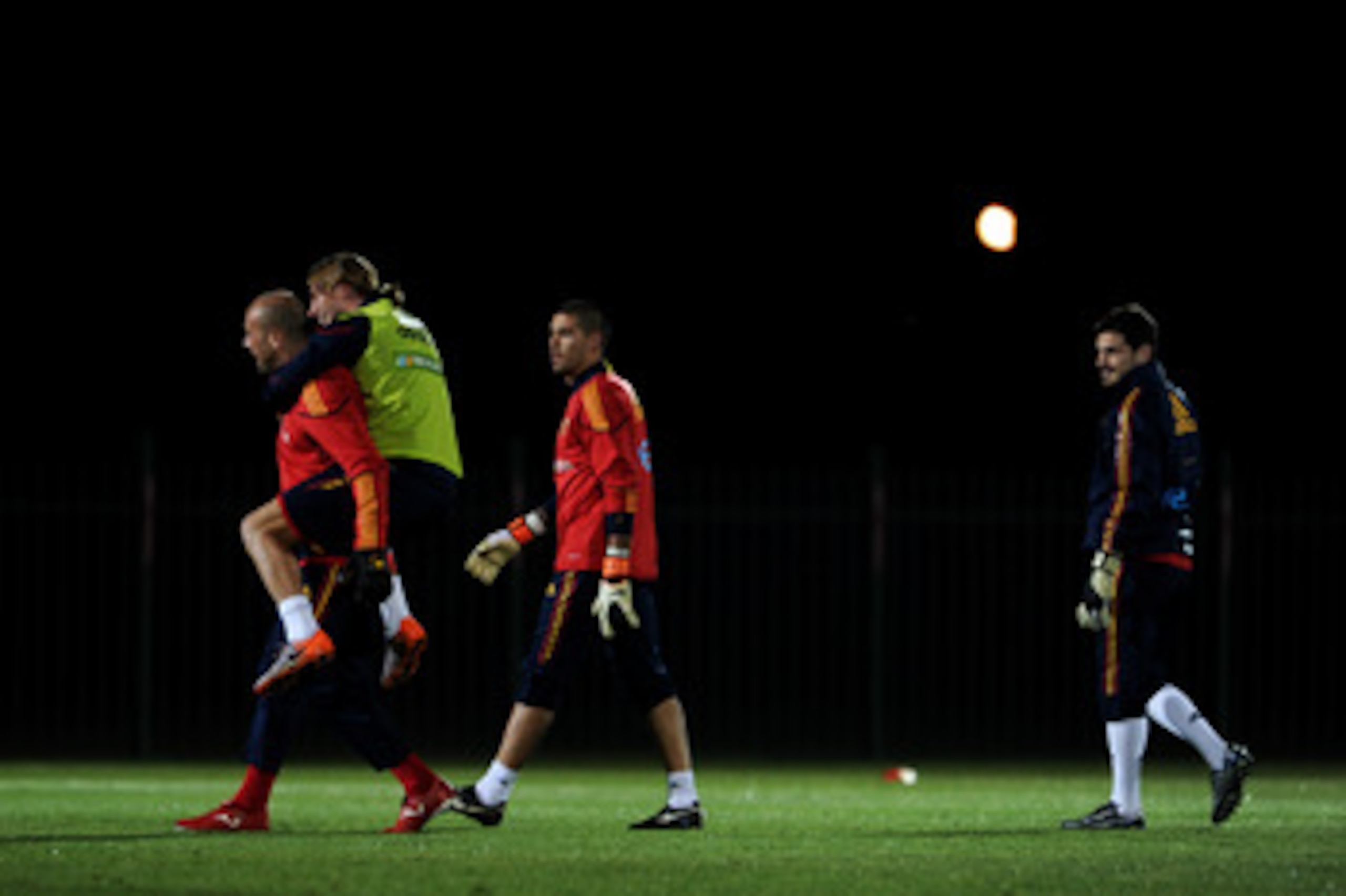 POTCHEFSTROOM, SOUTH AFRICA - JUNE 12: Sergio Ramos (2nd L) of Spain jokes with goalkeeper Pepe Reina (L) as goalkeepers Victor Valdes (2nd R) and Iker Casillas look on during a training session on June 12, 2010 in Potchefstroom, South Africa.  (Photo by