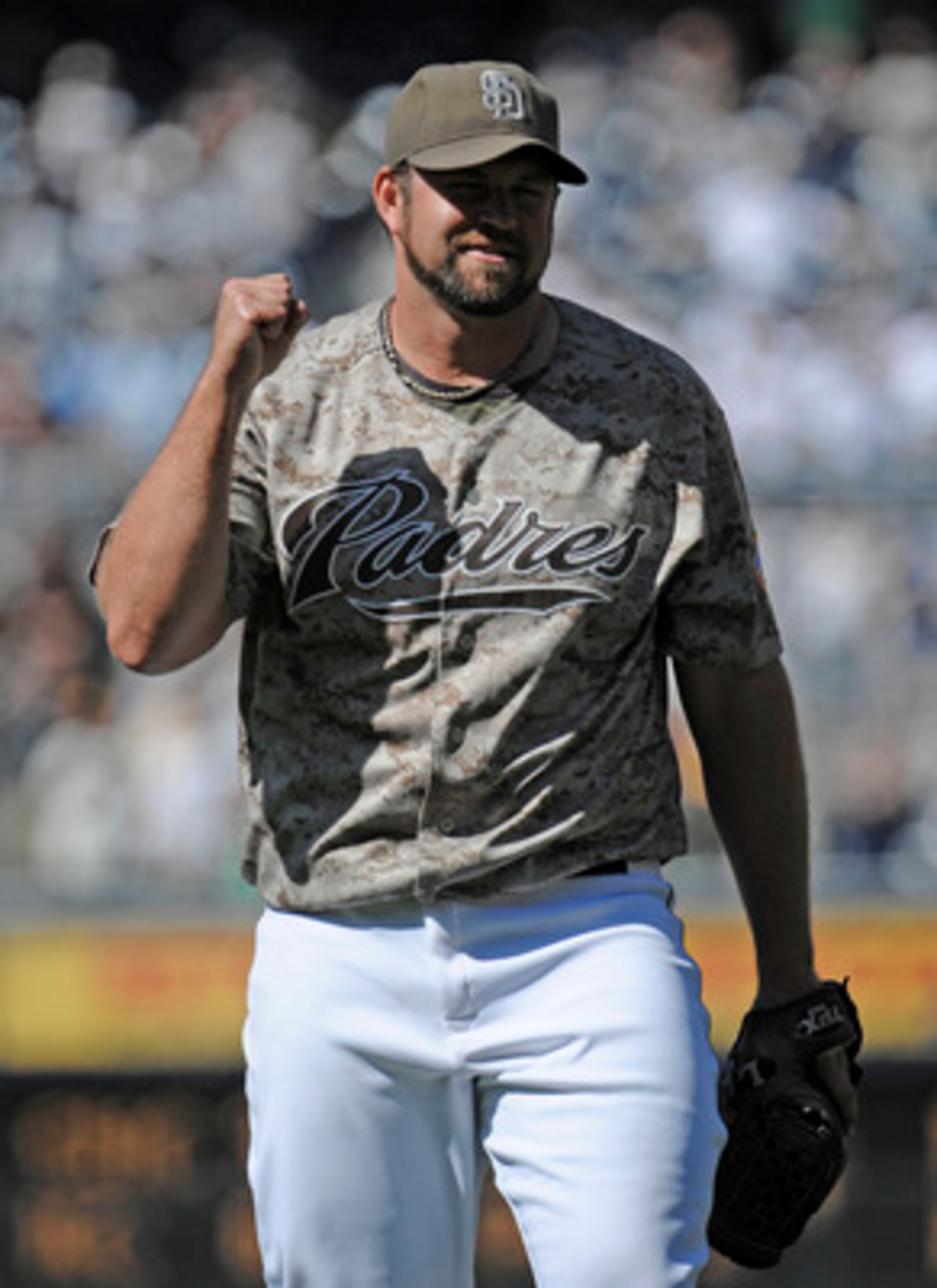SAN DIEGO, CA - JUNE 26: Heath Bell #21 of the San Diego Padres pumps his fist after getting the final out during the ninth inning of a baseball game against the Atlanta Braves at Petco Park on June 26, 2011 in San Diego, California. The Padres won 4-1.