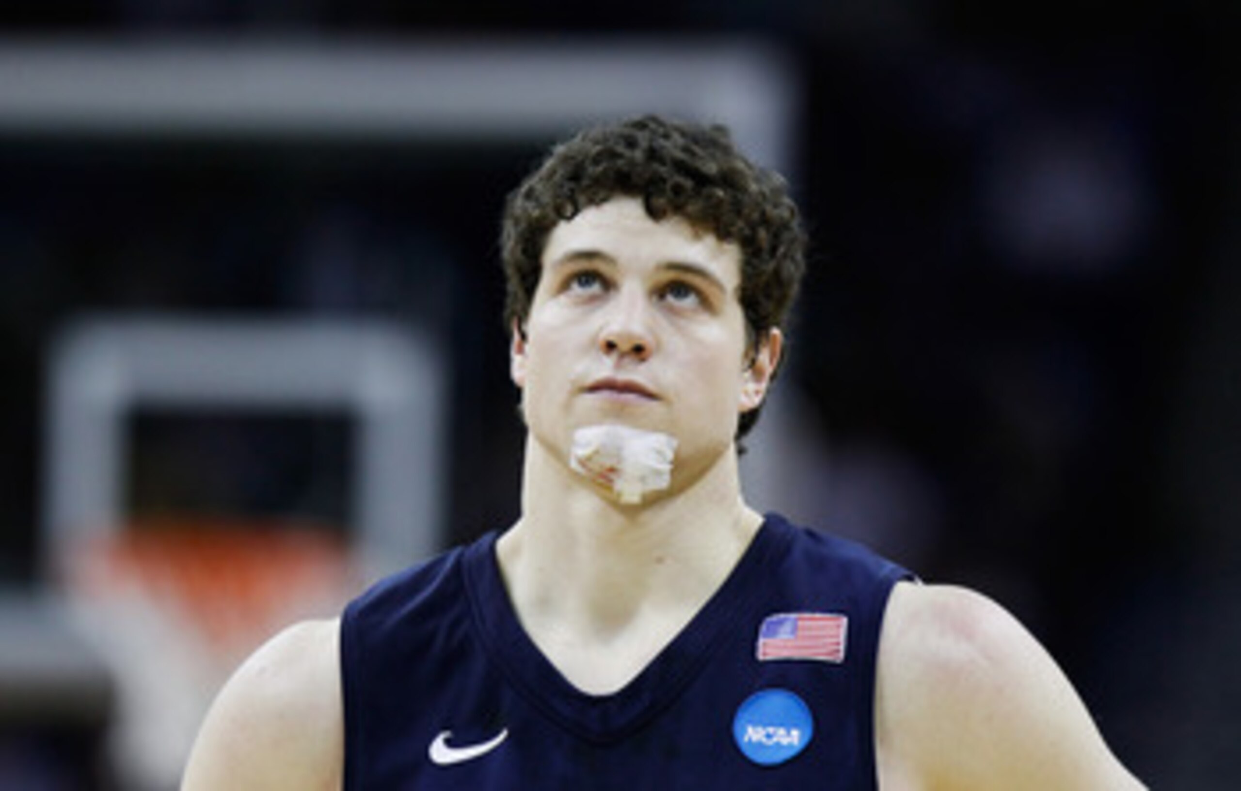 NEW ORLEANS, LA - MARCH 24: Jimmer Fredette #32 of the Brigham Young Cougars looks on with a bandage on his chin during the second half against the Florida Gators during the Southeast regional of the 2011 NCAA men's basketball tournament at New Orleans A NEW ORLEANS, LA - MARCH 24: Jimmer Fredette #32 of the Brigham Young Cougars looks on with a bandage on his chin during the second half against the Florida Gators during the Southeast regional of the 2011 NCAA men's basketball tournament at New Orleans A