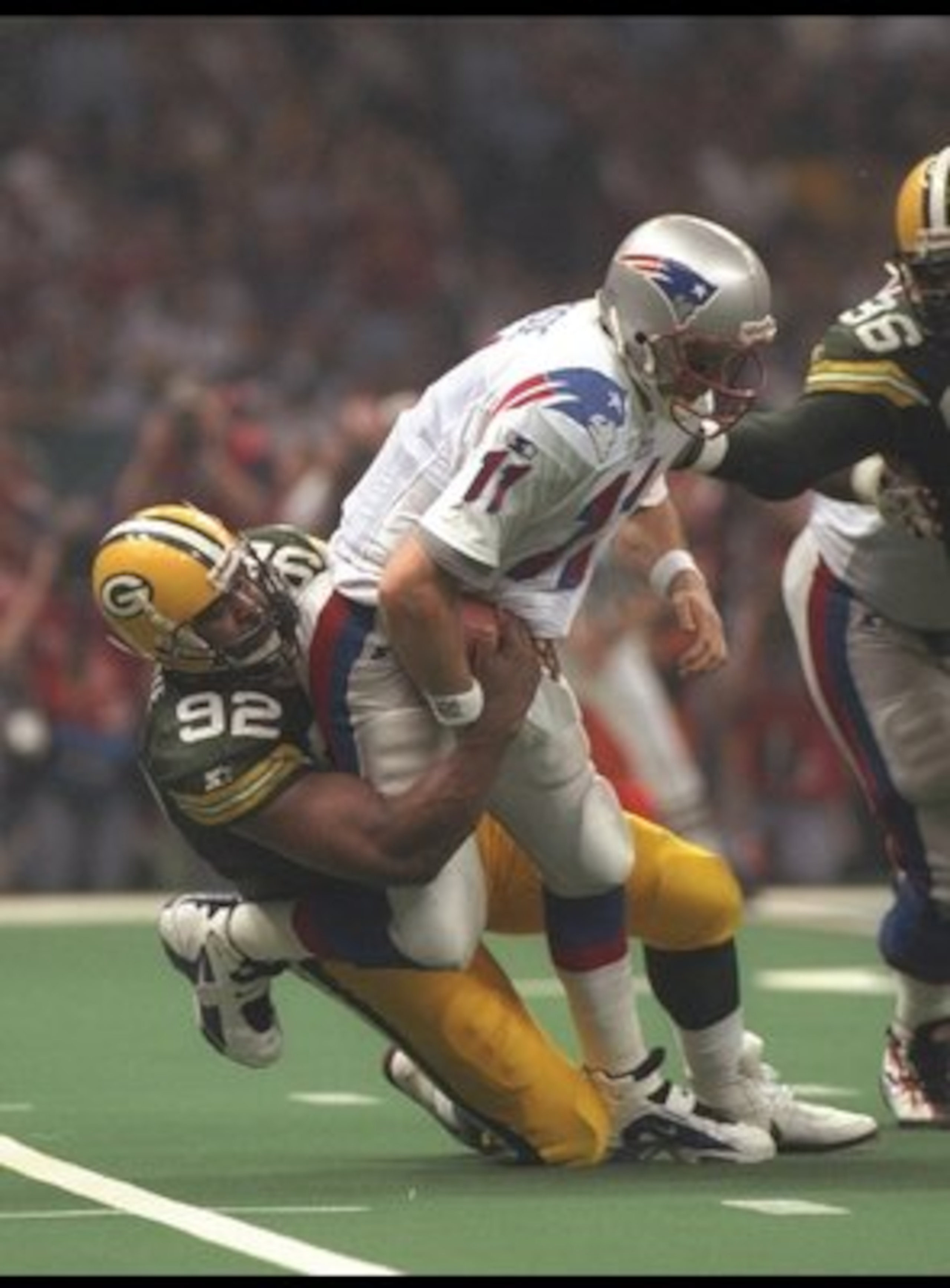 26 Jan 1997: Defensive end Reggie White #92 of the Green Bay Packers sacks quarterback Drew Bledsoe #11 of the New England Patriots during the 3rd quarter of Super Bowl XXXI at the Louisiana Superdome in New Orleans, Louisiana. Mandatory Credit: Doug P 26 Jan 1997: Defensive end Reggie White #92 of the Green Bay Packers sacks quarterback Drew Bledsoe #11 of the New England Patriots during the 3rd quarter of Super Bowl XXXI at the Louisiana Superdome in New Orleans, Louisiana. Mandatory Credit: Doug P