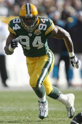GREEN BAY - NOVEMBER 18:  Kabeer Gbaja-Biamila #94 of the Green Bay Packers runs during the NFL game against the Carolina Panthers at Lambeau Field on November 18, 2007 in Green Bay, Wisconsin. (Photo by Jonathan Daniel/Getty Images)