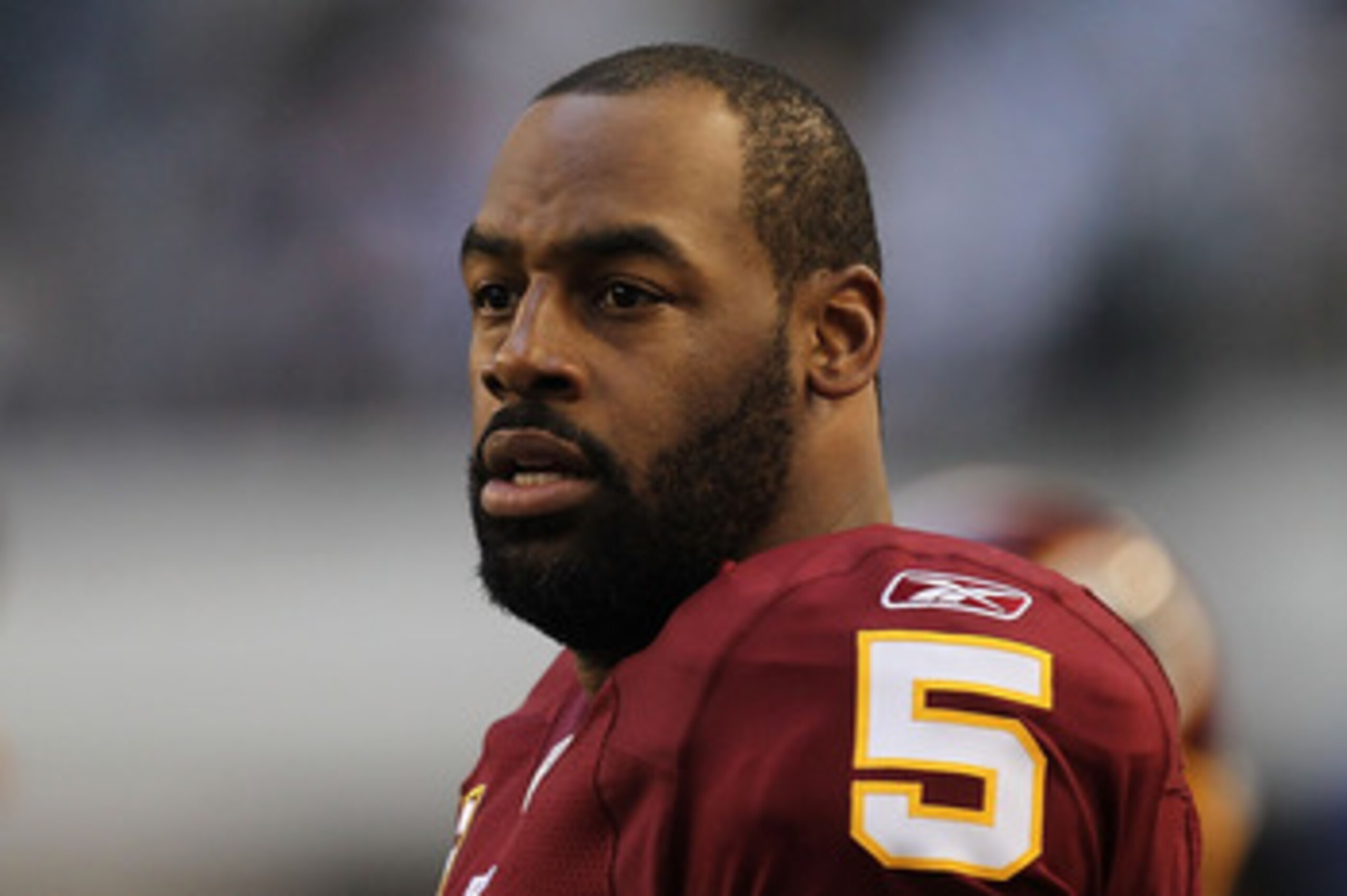 ARLINGTON, TX - DECEMBER 19:  Quarterback Donovan McNabb #5  of the Washington Redskins on the sidelines against play against the Dallas Cowboys at Cowboys Stadium on December 19, 2010 in Arlington, Texas.  (Photo by Ronald Martinez/Getty Images)