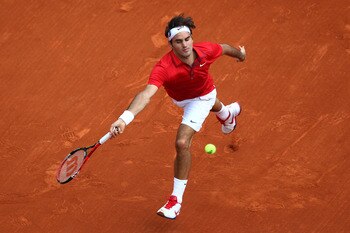 PARIS, FRANCE - JUNE 05: Roger Federer of Switzerland hits a forehand during the men's singles final match between Rafael Nadal of Spain and Roger Federer of Switzerland on day fifteen of the French Open at Roland Garros on June 5, 2011 in Paris, France. PARIS, FRANCE - JUNE 05: Roger Federer of Switzerland hits a forehand during the men's singles final match between Rafael Nadal of Spain and Roger Federer of Switzerland on day fifteen of the French Open at Roland Garros on June 5, 2011 in Paris, France.