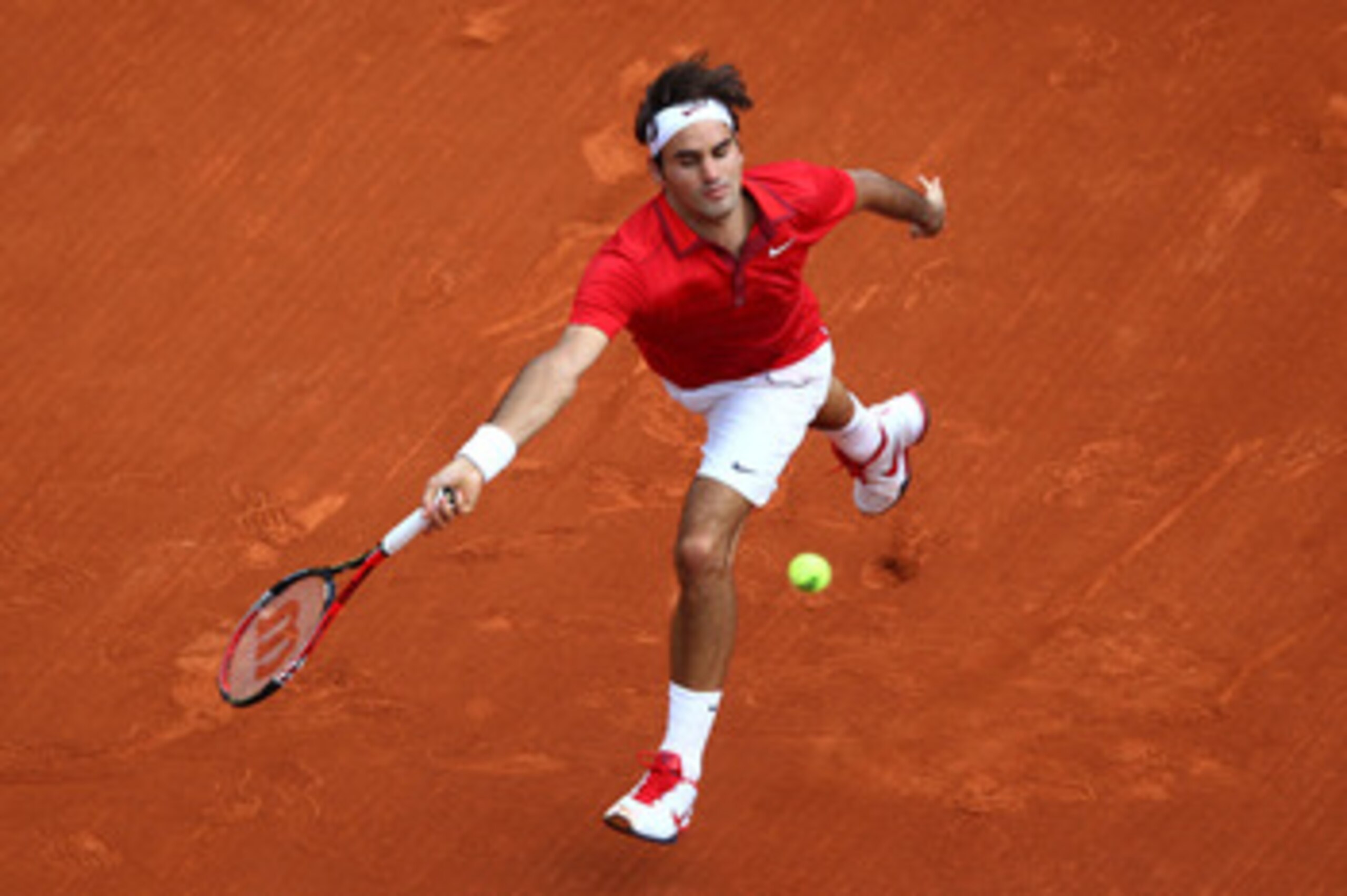 PARIS, FRANCE - JUNE 05: Roger Federer of Switzerland hits a forehand during the men's singles final match between Rafael Nadal of Spain and Roger Federer of Switzerland on day fifteen of the French Open at Roland Garros on June 5, 2011 in Paris, France. PARIS, FRANCE - JUNE 05: Roger Federer of Switzerland hits a forehand during the men's singles final match between Rafael Nadal of Spain and Roger Federer of Switzerland on day fifteen of the French Open at Roland Garros on June 5, 2011 in Paris, France.