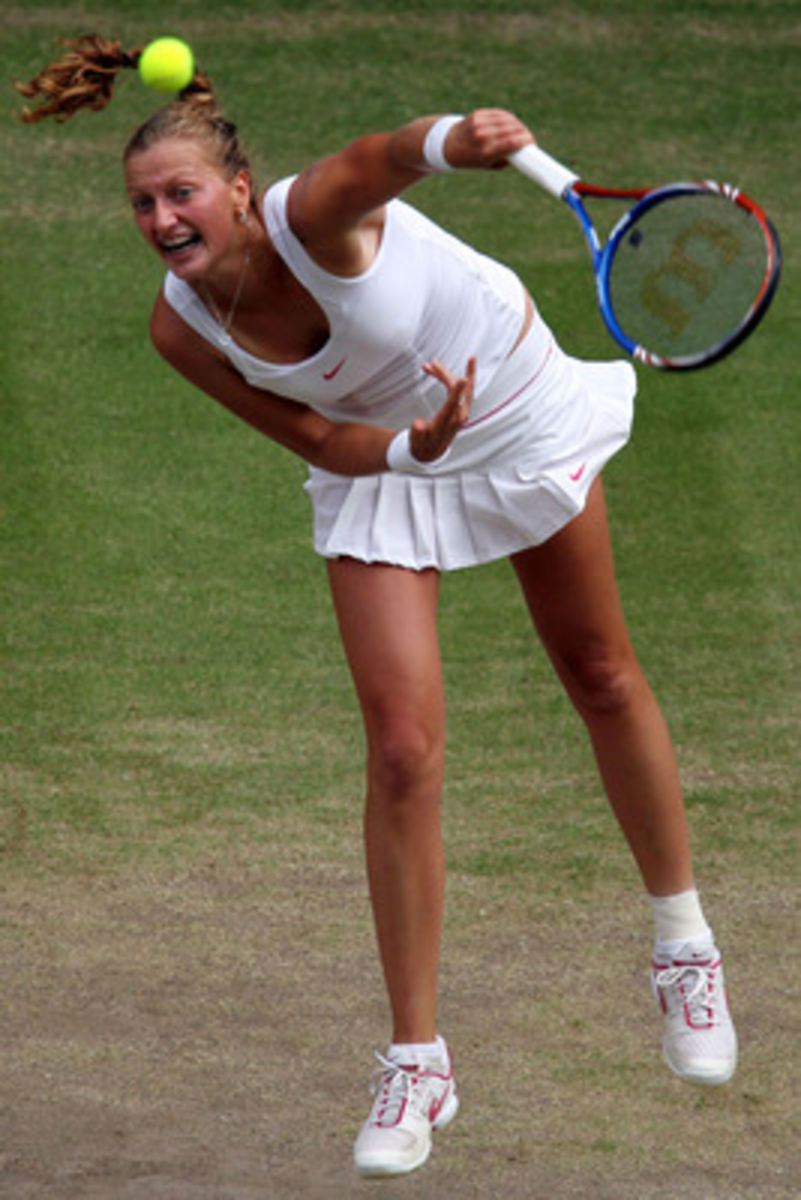 LONDON, ENGLAND - JULY 01: Petra Kvitova of Czech Republic serves on Day Ten of the Wimbledon Lawn Tennis Championships at the All England Lawn Tennis and Croquet Club on July 1, 2010 in London, England. (Photo by Alaistair Grant-Pool/Getty Images) LONDON, ENGLAND - JULY 01: Petra Kvitova of Czech Republic serves on Day Ten of the Wimbledon Lawn Tennis Championships at the All England Lawn Tennis and Croquet Club on July 1, 2010 in London, England. (Photo by Alaistair Grant-Pool/Getty Images)