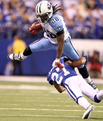 INDIANAPOLIS - JANUARY 02:  Chris Johnson #28 of the Tennessee Titans is tackled by Jacob Lacey #27 of the Indianapolis Colts at Lucas Oil Stadium on January 2, 2011 in Indianapolis, Indiana.  the Colts won 23-20.  (Photo by Andy Lyons/Getty Images)