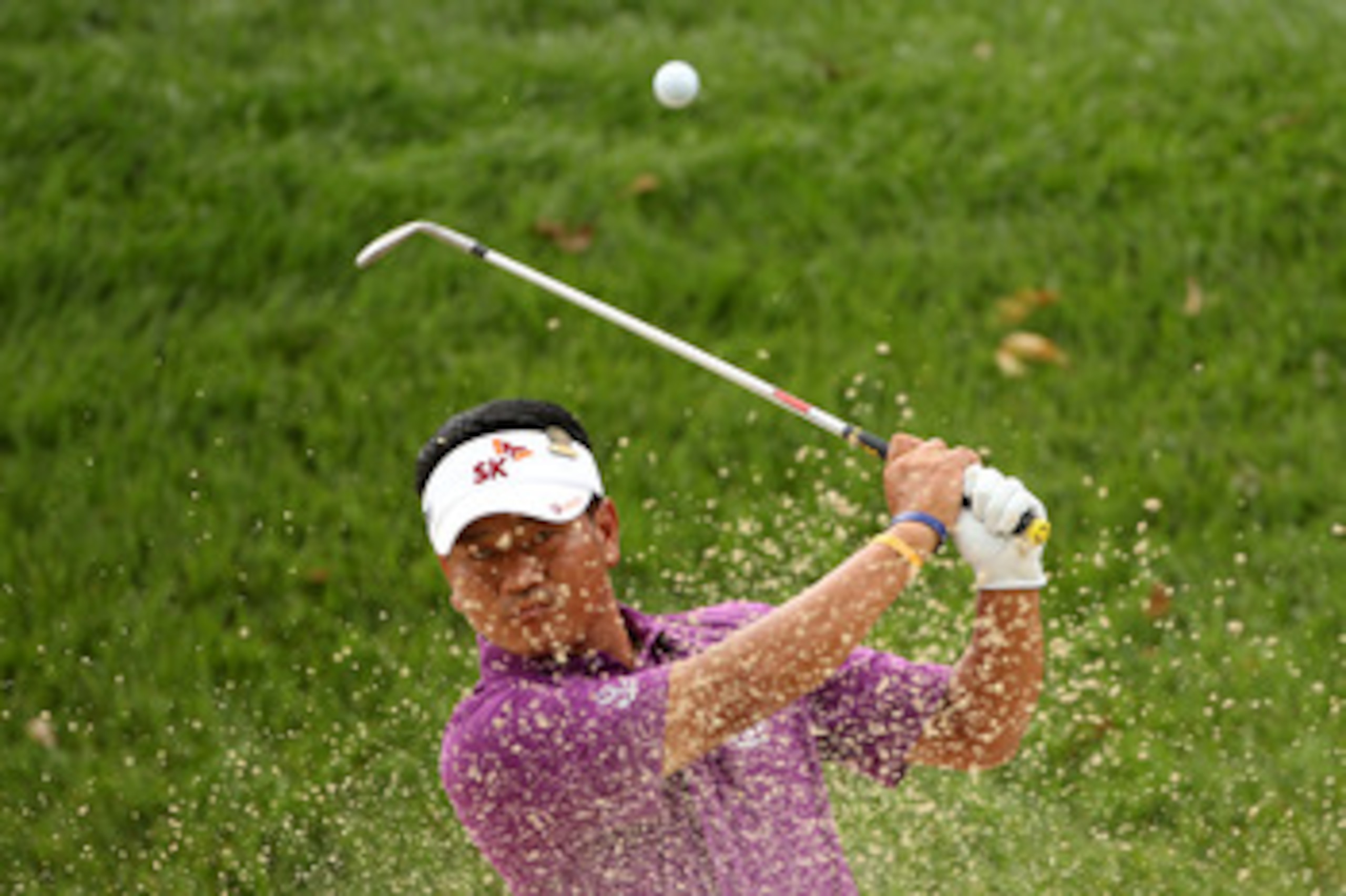 BETHESDA, MD - JUNE 14:  K.J. Choi of South Korea plays a bunker shot during a practice round prior to the start of the 111th U.S. Open at Congressional Country Club on June 14, 2011 in Bethesda, Maryland.  (Photo by Andrew Redington/Getty Images)