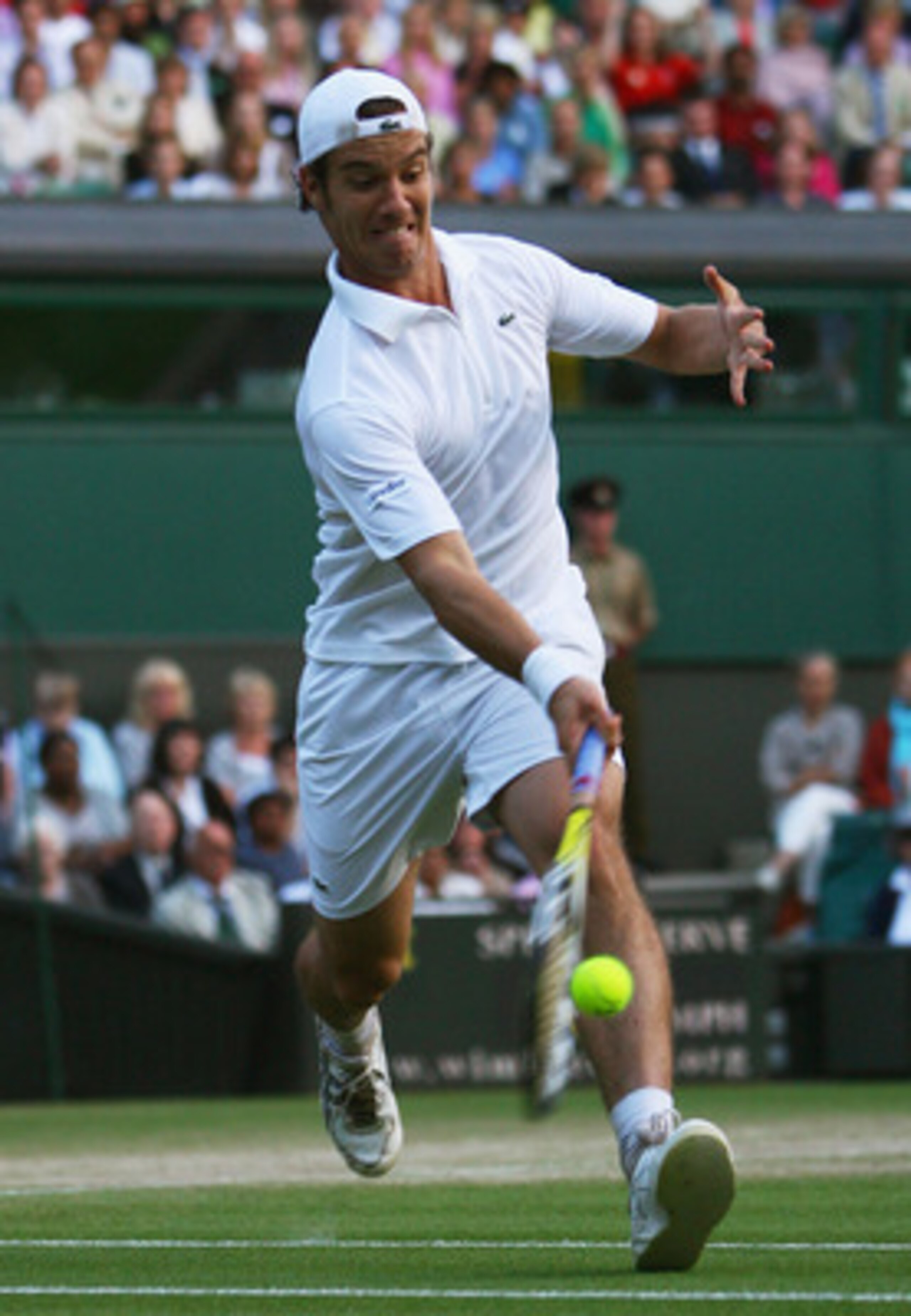 LONDON - JUNE 30: Richard Gasquet of France plays a forehand during the men's singles round four match against Andy Murray of Great Britain on day seven of the Wimbledon Lawn Tennis Championships at the All England Lawn Tennis and Croquet Club on June 30 LONDON - JUNE 30: Richard Gasquet of France plays a forehand during the men's singles round four match against Andy Murray of Great Britain on day seven of the Wimbledon Lawn Tennis Championships at the All England Lawn Tennis and Croquet Club on June 30