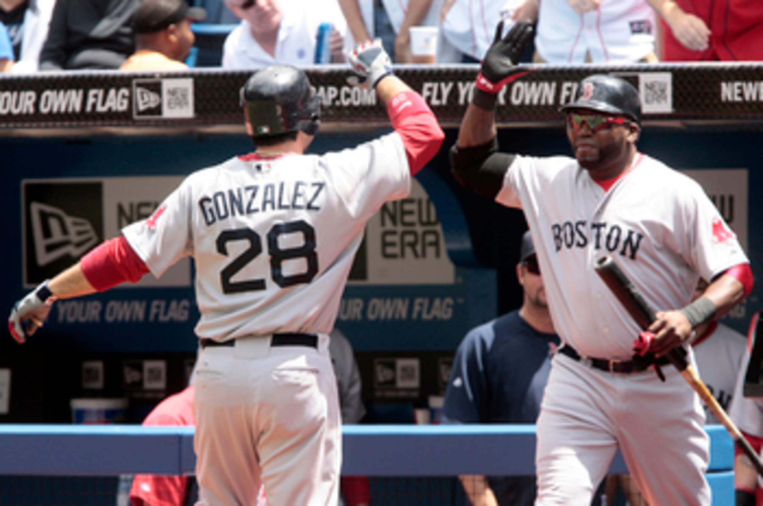 TORONTO, CANADA - JUNE 12:  Adrian Gonzalez #28 and David Ortiz #34 of the Boston Red Sox celebrate a home run during MLB action against the Toronto Blue Jays at The Rogers Centre June 12, 2011 in Toronto, Ontario, Canada. (Photo by Abelimages/Getty Image