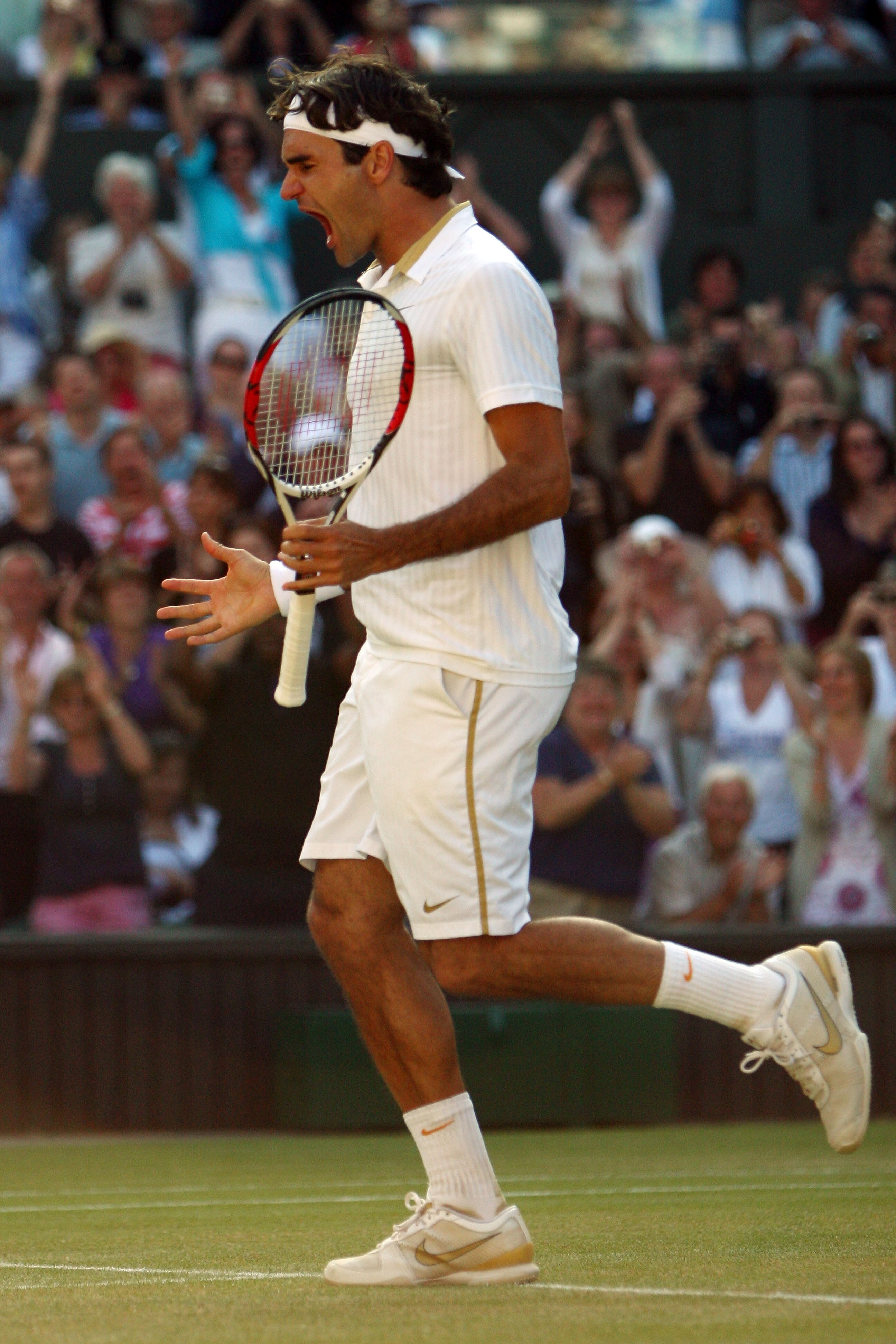 WIMBLEDON, ENGLAND - JULY 05:  Roger Federer of Switzerland celebrates victory during the men's singles final match against Andy Roddick of USA on Day Thirteen of the Wimbledon Lawn Tennis Championships at the All England Lawn Tennis and Croquet Club on J