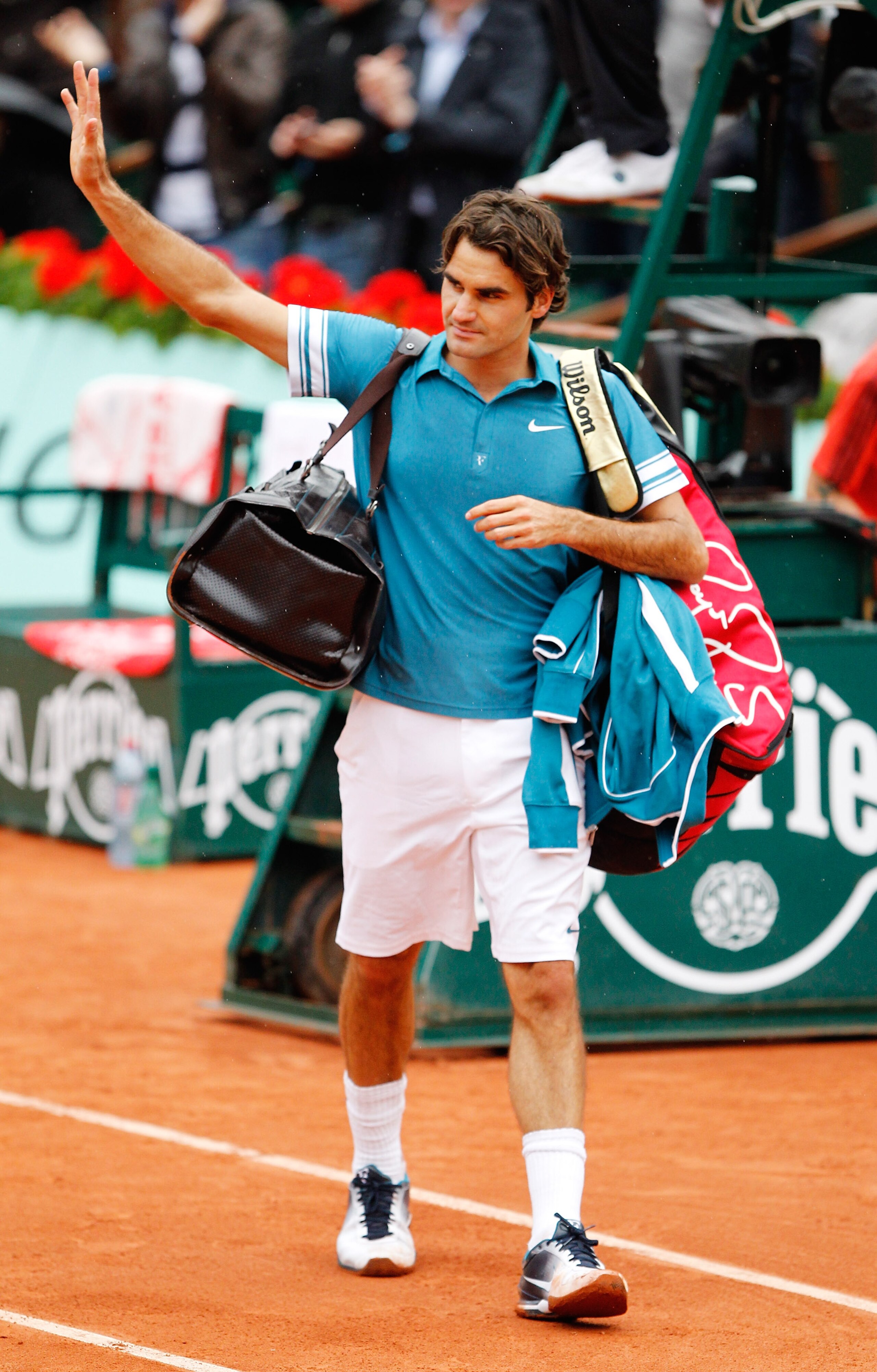 PARIS - JUNE 01:  Roger Federer of Switzerland walks off after losing the men's singles quarter final match between Robin Soderling of Sweden and Roger Federer of Switzerland at the French Open on day ten of the French Open at Roland Garros on June 1, 201