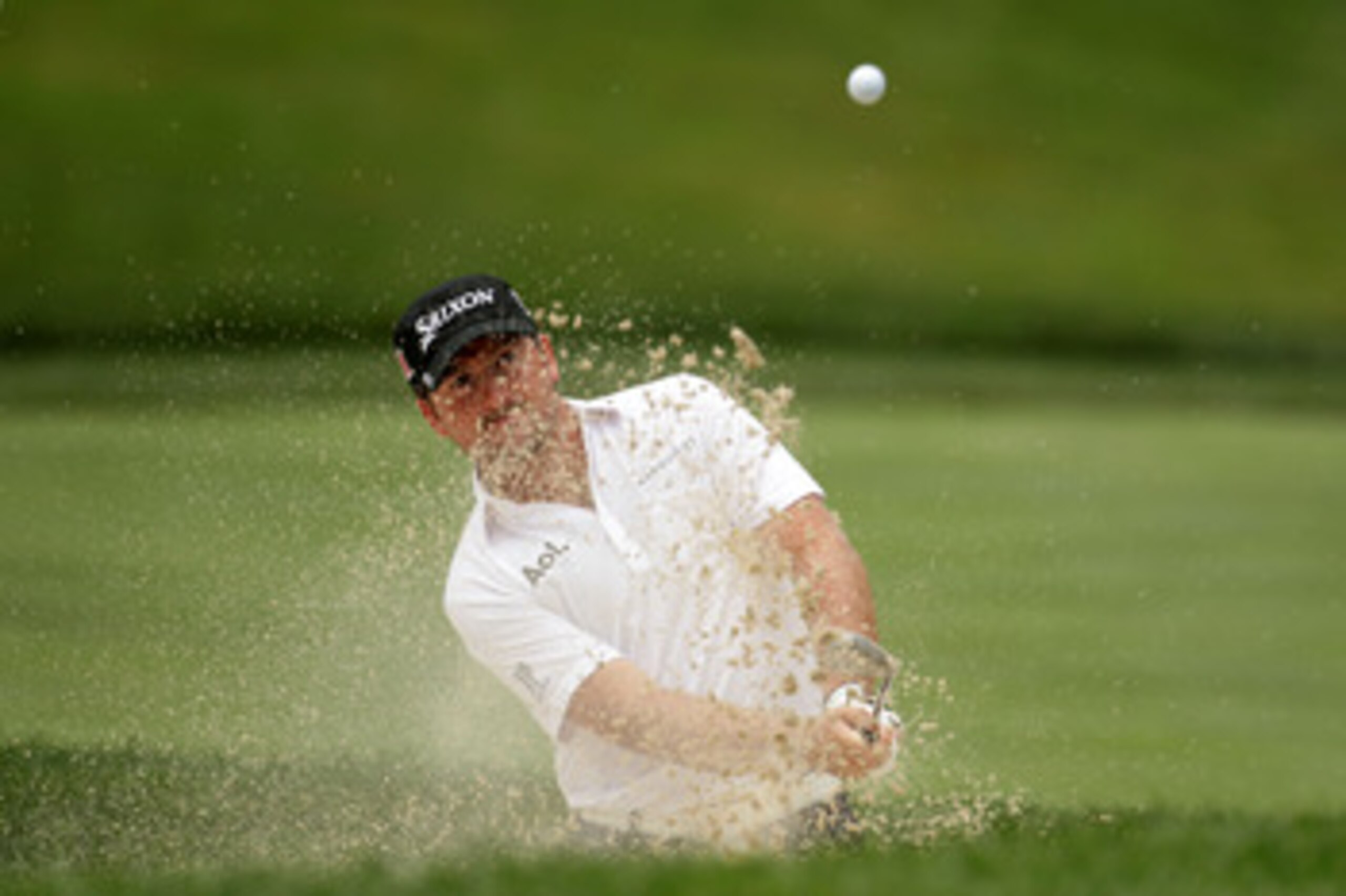 BETHESDA, MD - JUNE 14:  Graeme McDowell of Northern Ireland plays a bunker shot during a practice round prior to the start of the 111th U.S. Open at Congressional Country Club on June 14, 2011 in Bethesda, Maryland.  (Photo by Ross Kinnaird/Getty Images)