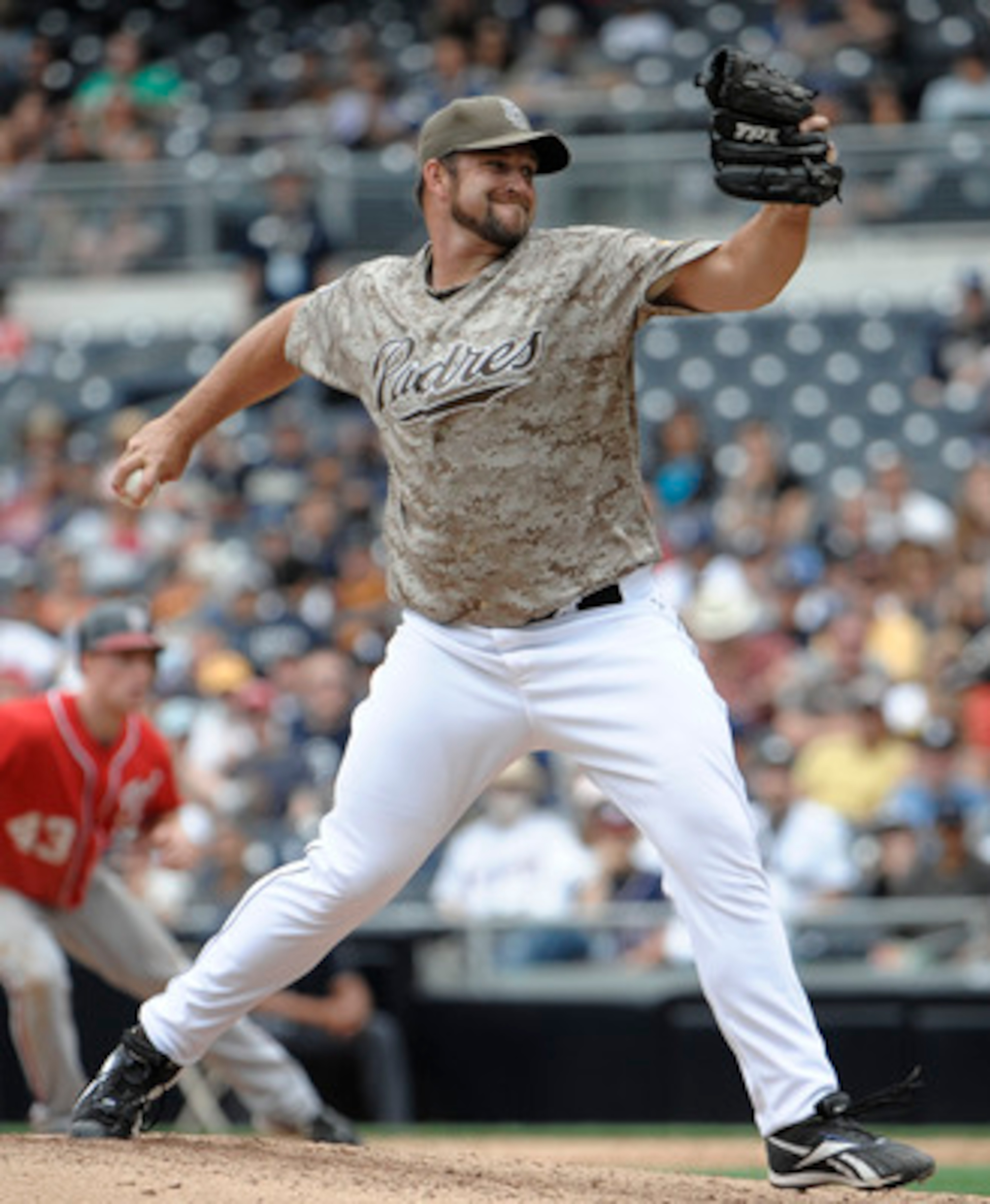 SAN DIEGO, CA - JUNE 12: Heath Bell #21 of the San Diego Padres pitches during the ninth inning of a baseball game against the Washington Nationals at Petco Park on June 12, 2011 in San Diego, California. The Nationals won 2-0. (Photo by Denis Poroy/Get SAN DIEGO, CA - JUNE 12: Heath Bell #21 of the San Diego Padres pitches during the ninth inning of a baseball game against the Washington Nationals at Petco Park on June 12, 2011 in San Diego, California. The Nationals won 2-0. (Photo by Denis Poroy/Get