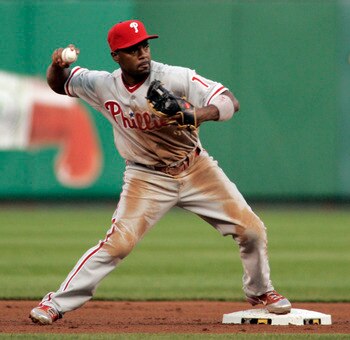 PITTSBURGH - JUNE 03: Jimmy Rollins #11 of the Philadelphia Phillies turns a double play against the Pittsburgh Pirates during the game on June 3, 2011 at PNC Park in Pittsburgh, Pennsylvania. The Pirates defeated the Phillies 2-1 in extra innings. (Pho PITTSBURGH - JUNE 03: Jimmy Rollins #11 of the Philadelphia Phillies turns a double play against the Pittsburgh Pirates during the game on June 3, 2011 at PNC Park in Pittsburgh, Pennsylvania. The Pirates defeated the Phillies 2-1 in extra innings. (Pho