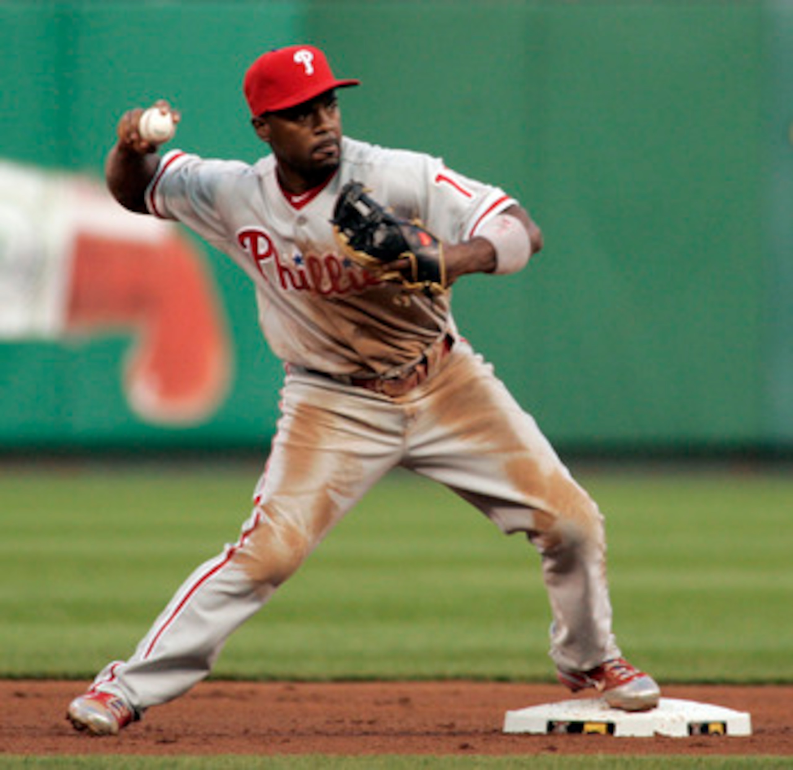 PITTSBURGH - JUNE 03:  Jimmy Rollins #11 of the Philadelphia Phillies turns a double play against the Pittsburgh Pirates during the game on June 3, 2011 at PNC Park in Pittsburgh, Pennsylvania. The Pirates defeated the Phillies 2-1 in extra innings.  (Pho