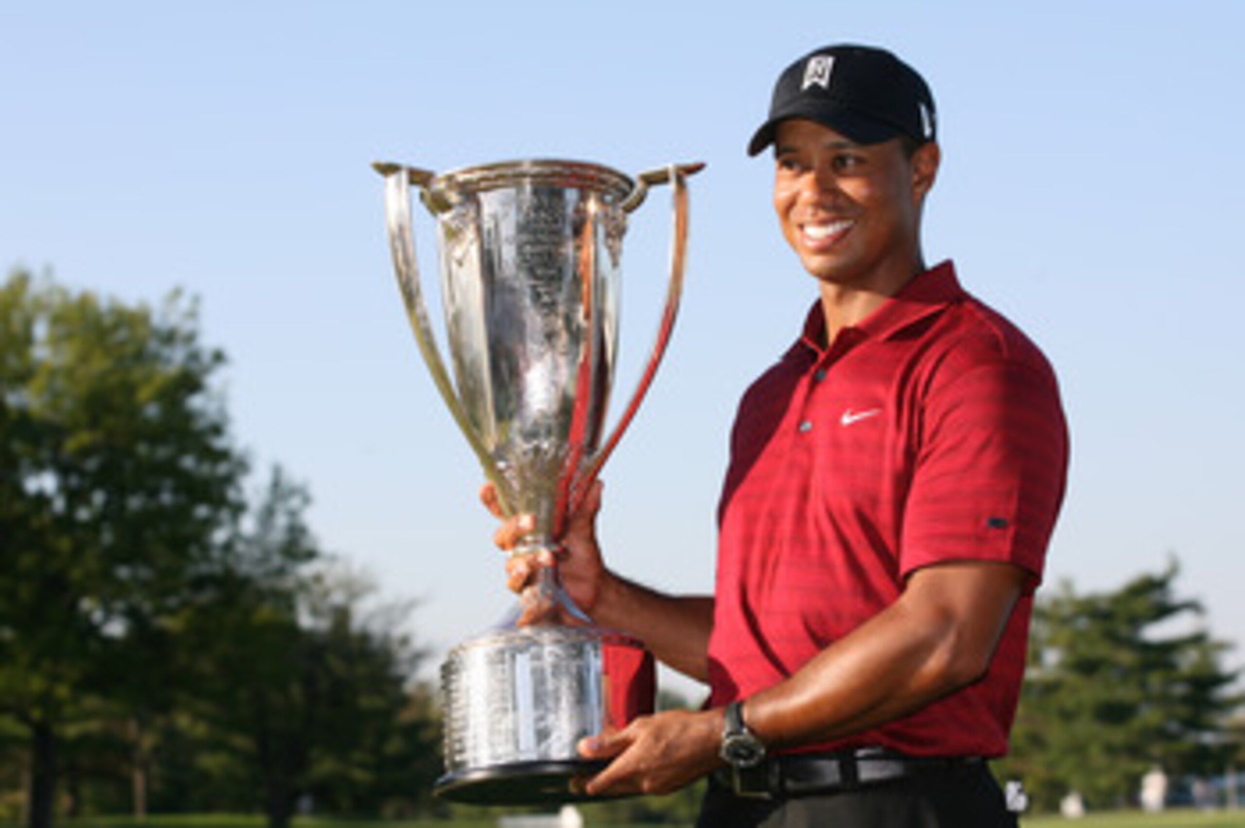LEMONT, IL - SEPTEMBER 13: Tiger Woods holds the J.K. Wadley trophy after winning the BMW Championship at Cog Hill Golf & Country Club on September 13, 2009 in Lemont, Illinois. (Photo by Hunter Martin/Getty Images) LEMONT, IL - SEPTEMBER 13: Tiger Woods holds the J.K. Wadley trophy after winning the BMW Championship at Cog Hill Golf & Country Club on September 13, 2009 in Lemont, Illinois. (Photo by Hunter Martin/Getty Images)